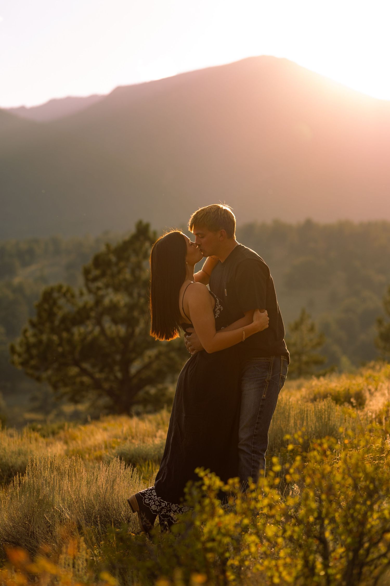 Candid moment captured between couple at romantic setting in Rocky Mountain National Park | Colorado