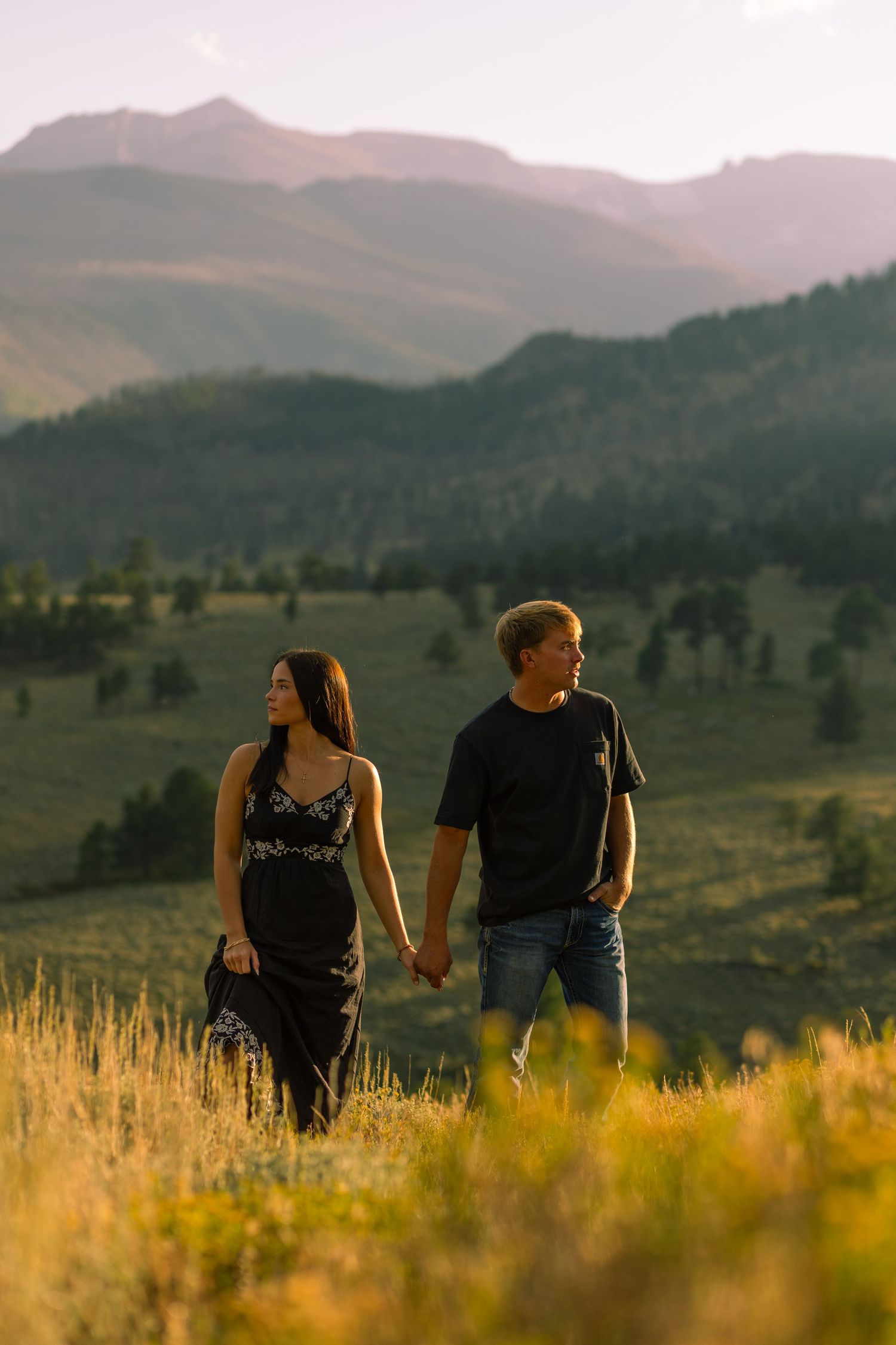 Editorial Couples Pose with the beautiful landscape of Rocky Mountain National Park.
