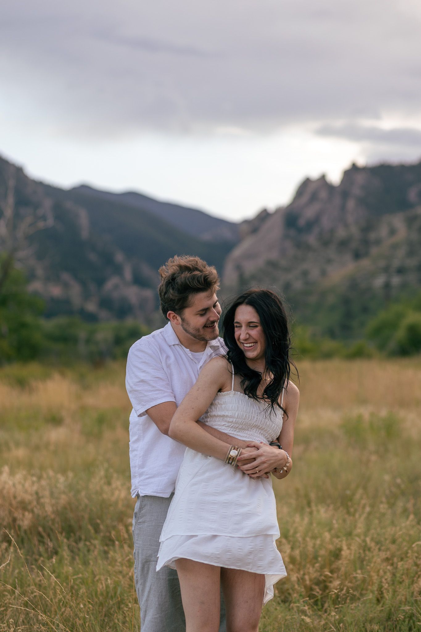 Candid moment captured between couple at romantic setting in Chautauqua Park | Colorado