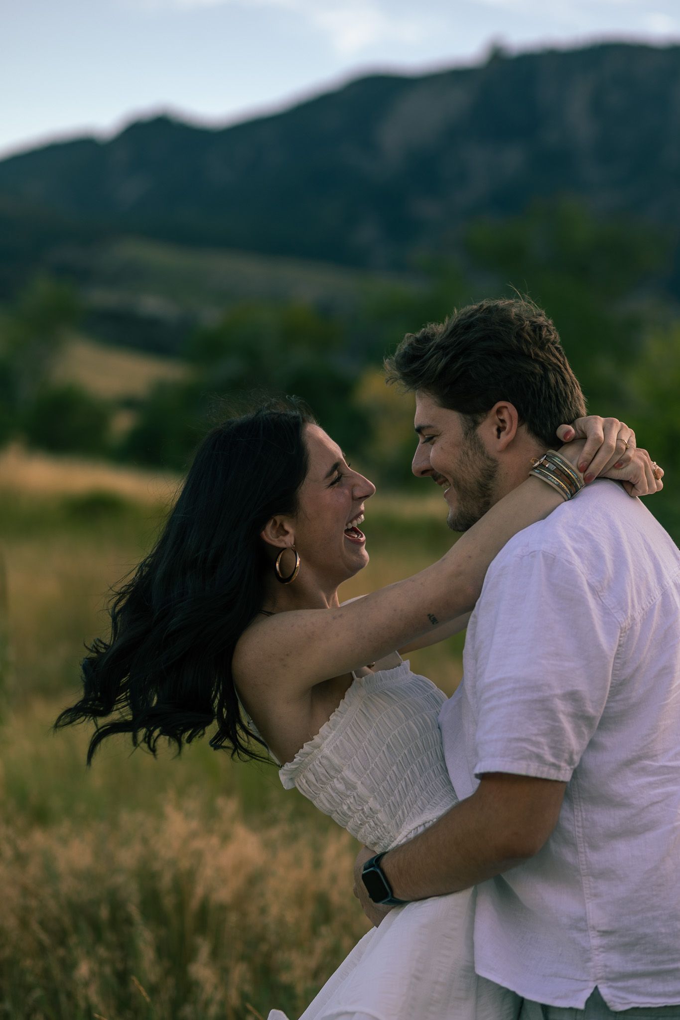 Candid moment captured between couple at romantic setting in Chautauqua Park | Colorado