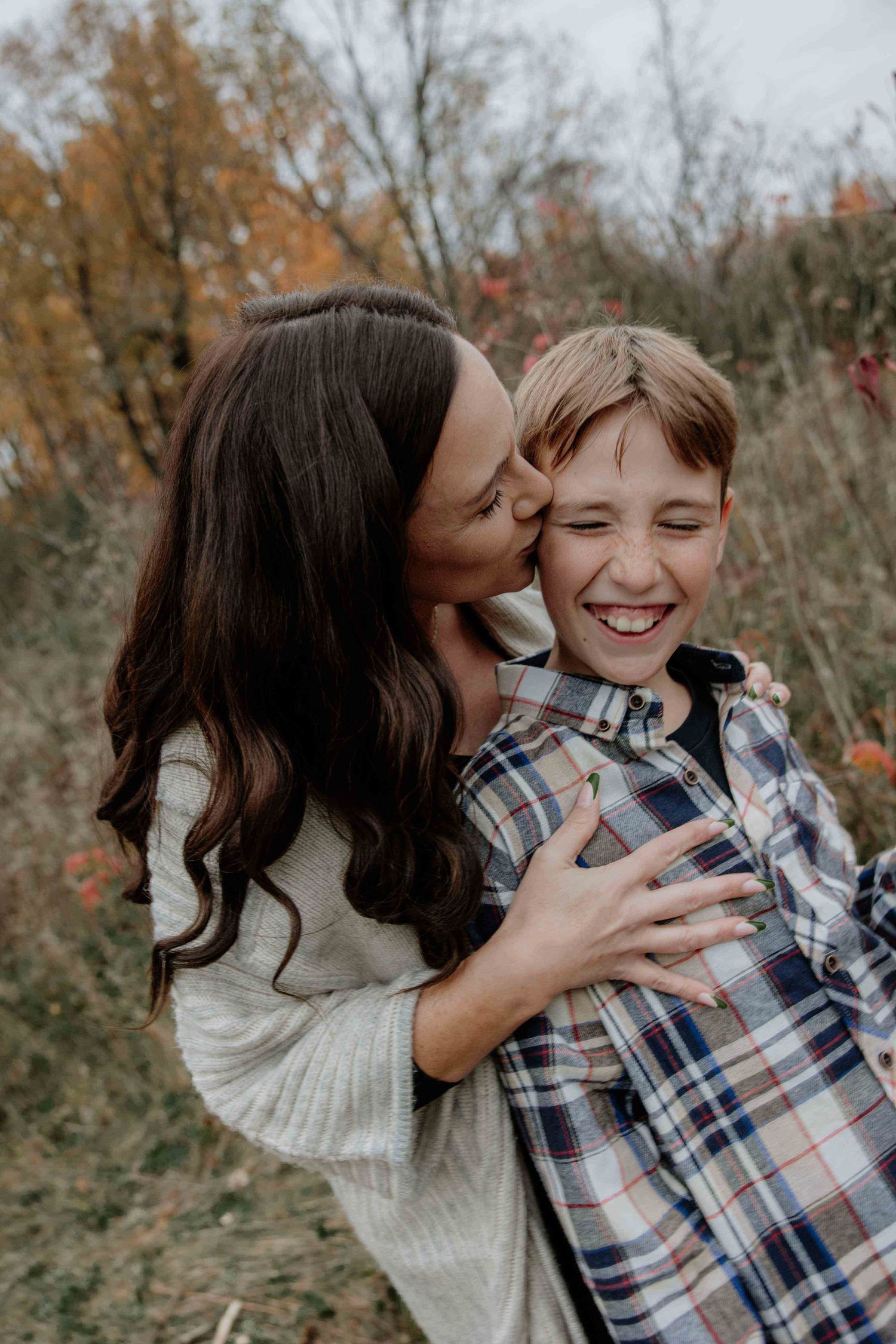 Two people share playful affectionate moments in a series of casual outdoor photos.