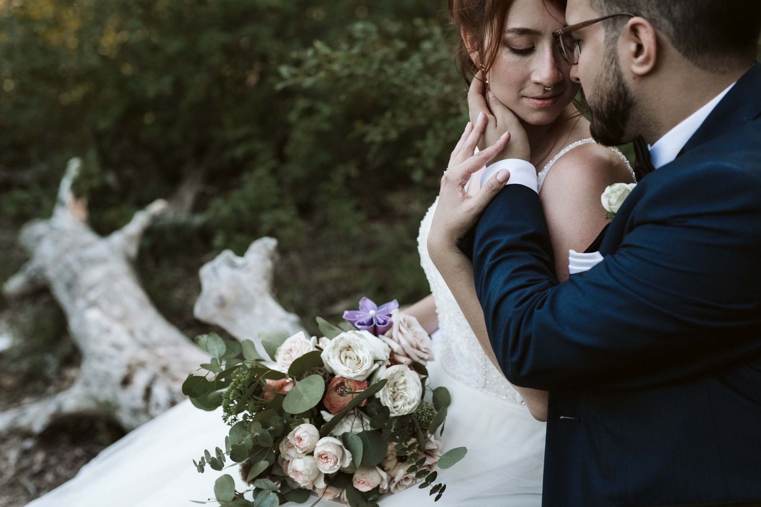 Intimate black and white wedding portrait with soft lighting.