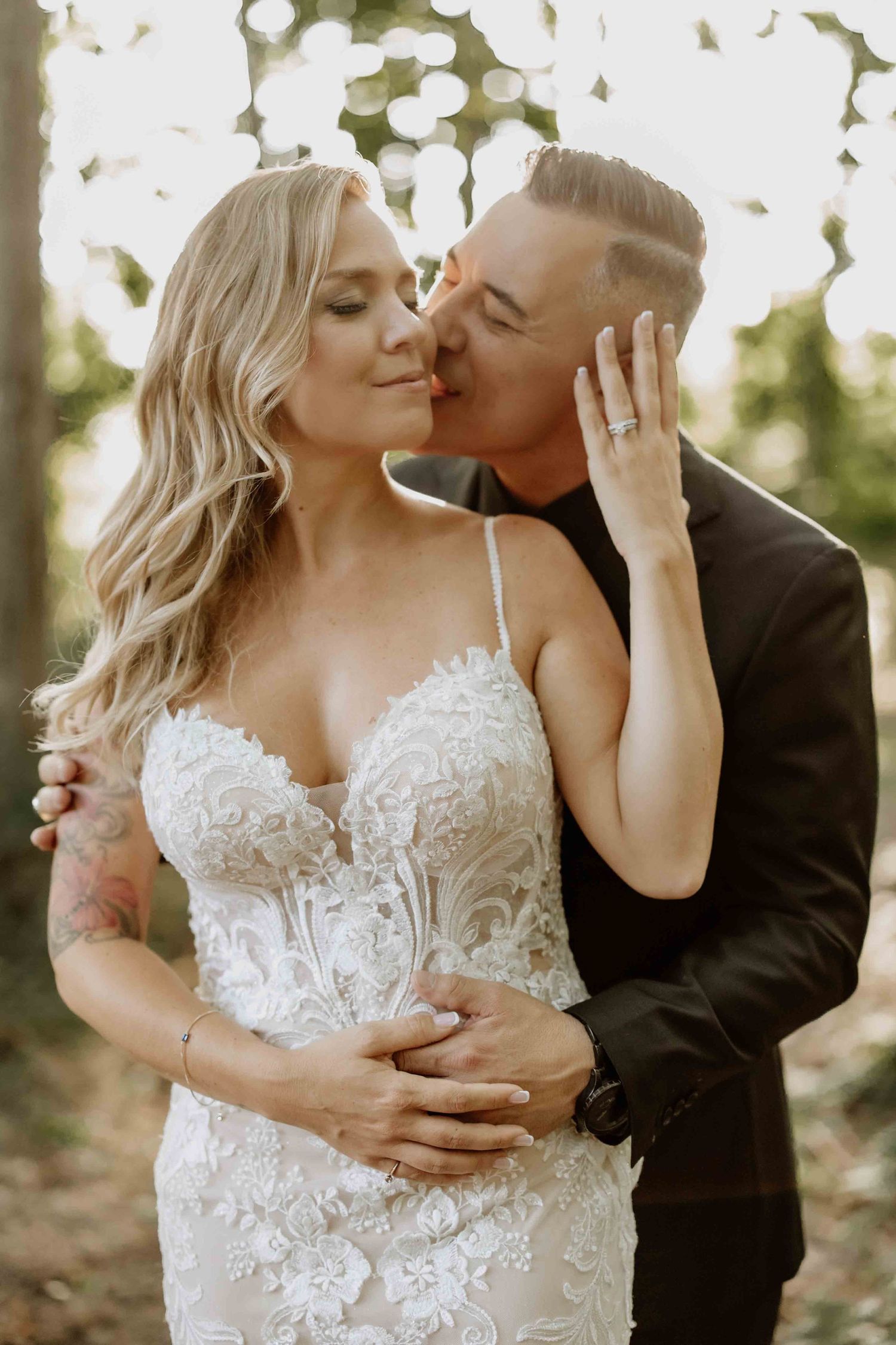 Intimate wedding portraits captured in soft natural lighting outdoors.
