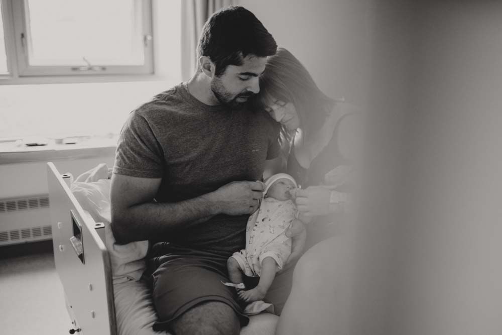 Indoor lifestyle photo session showing intimate moments between a couple.