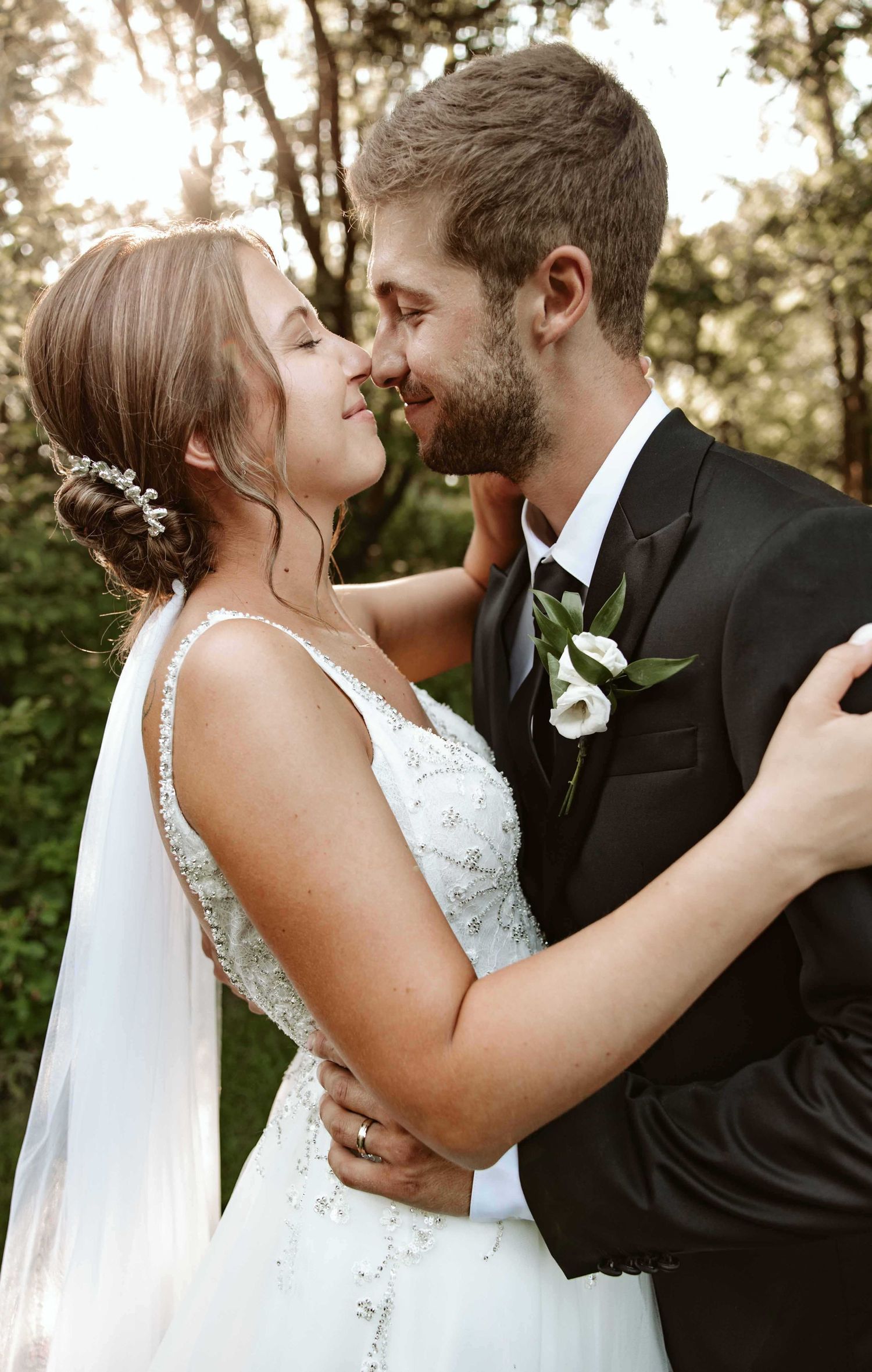 Romantic sunset wedding portraits captured in golden hour light.