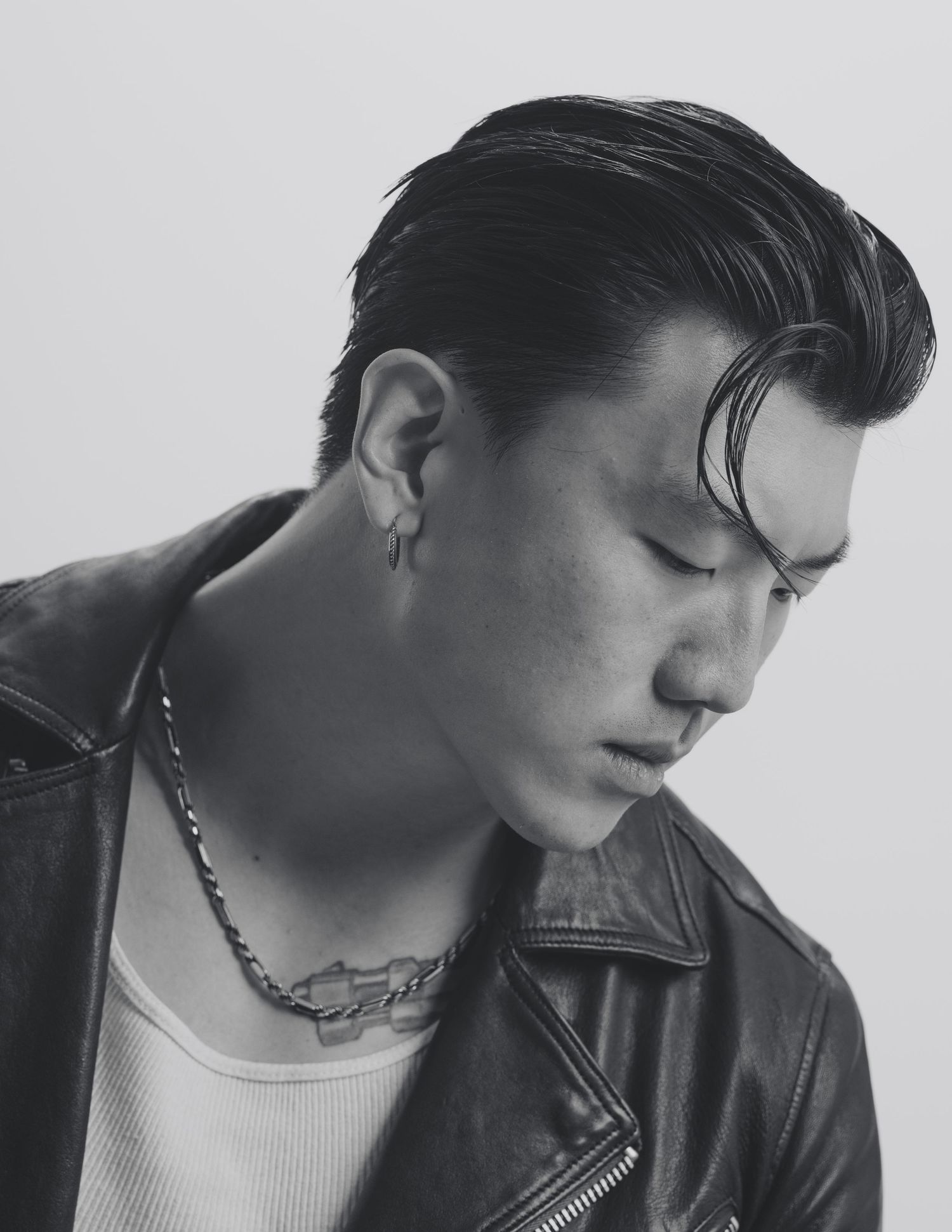 Black and white portrait series featuring leather jacket and minimalist styling.
