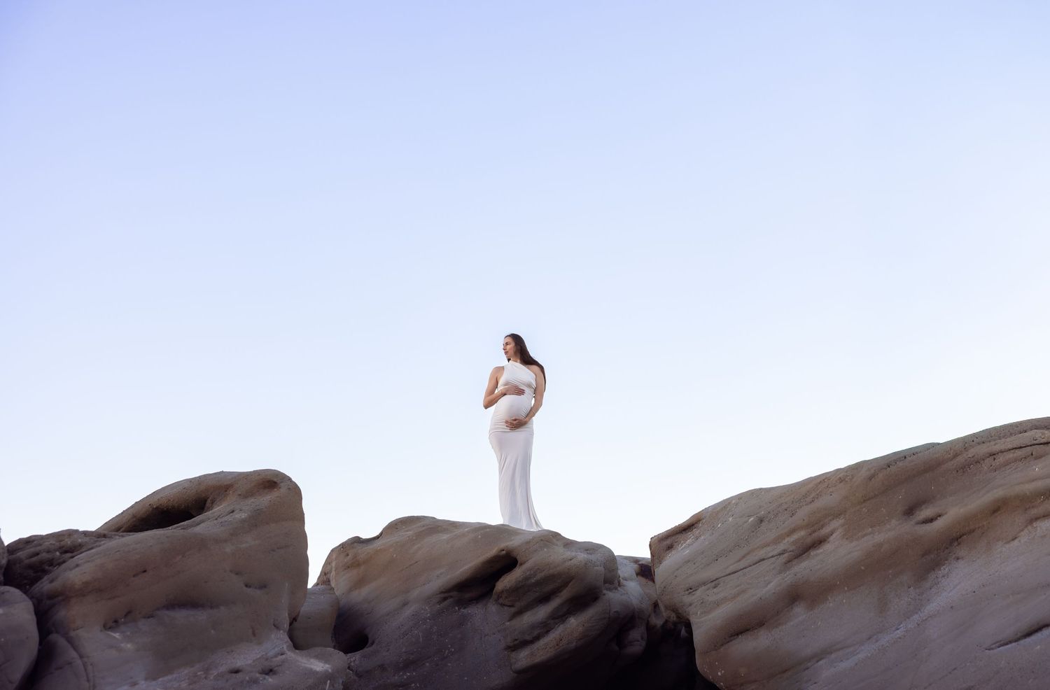 Adventure for your maternity photography to include the rocks at Redhead Beach