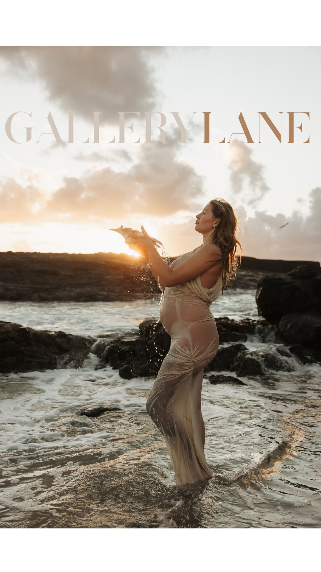 Pregnant mother holds shell in front of her as water pours out of it with the sun capturing glittering water droplets in golden light.