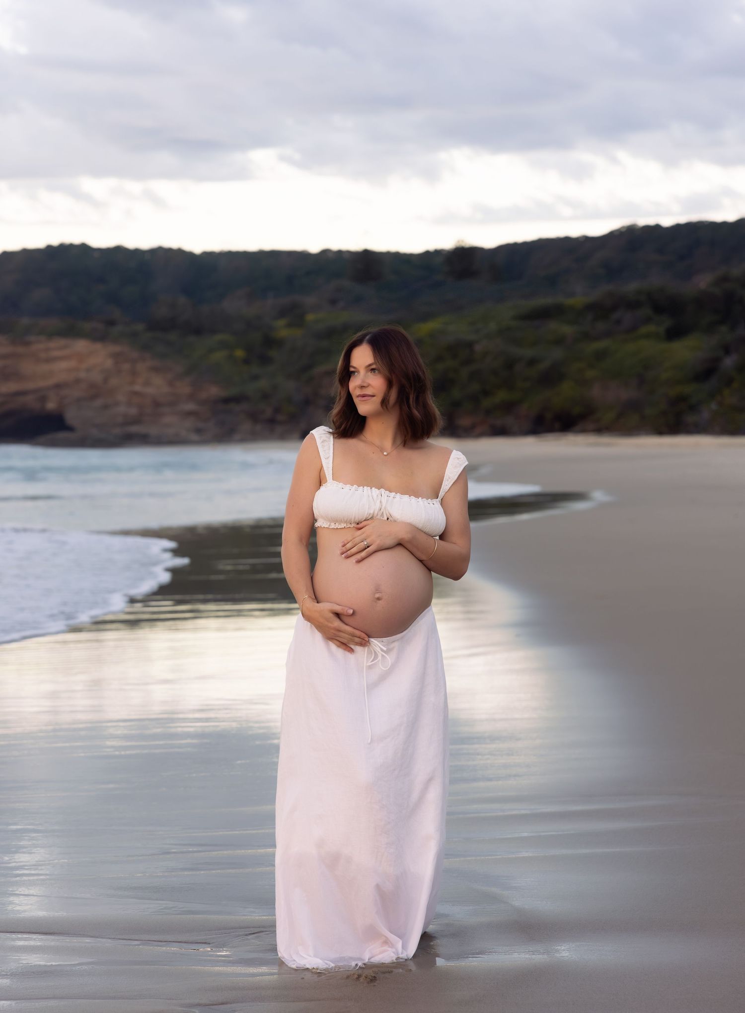 Elegant maternity photography at the beach