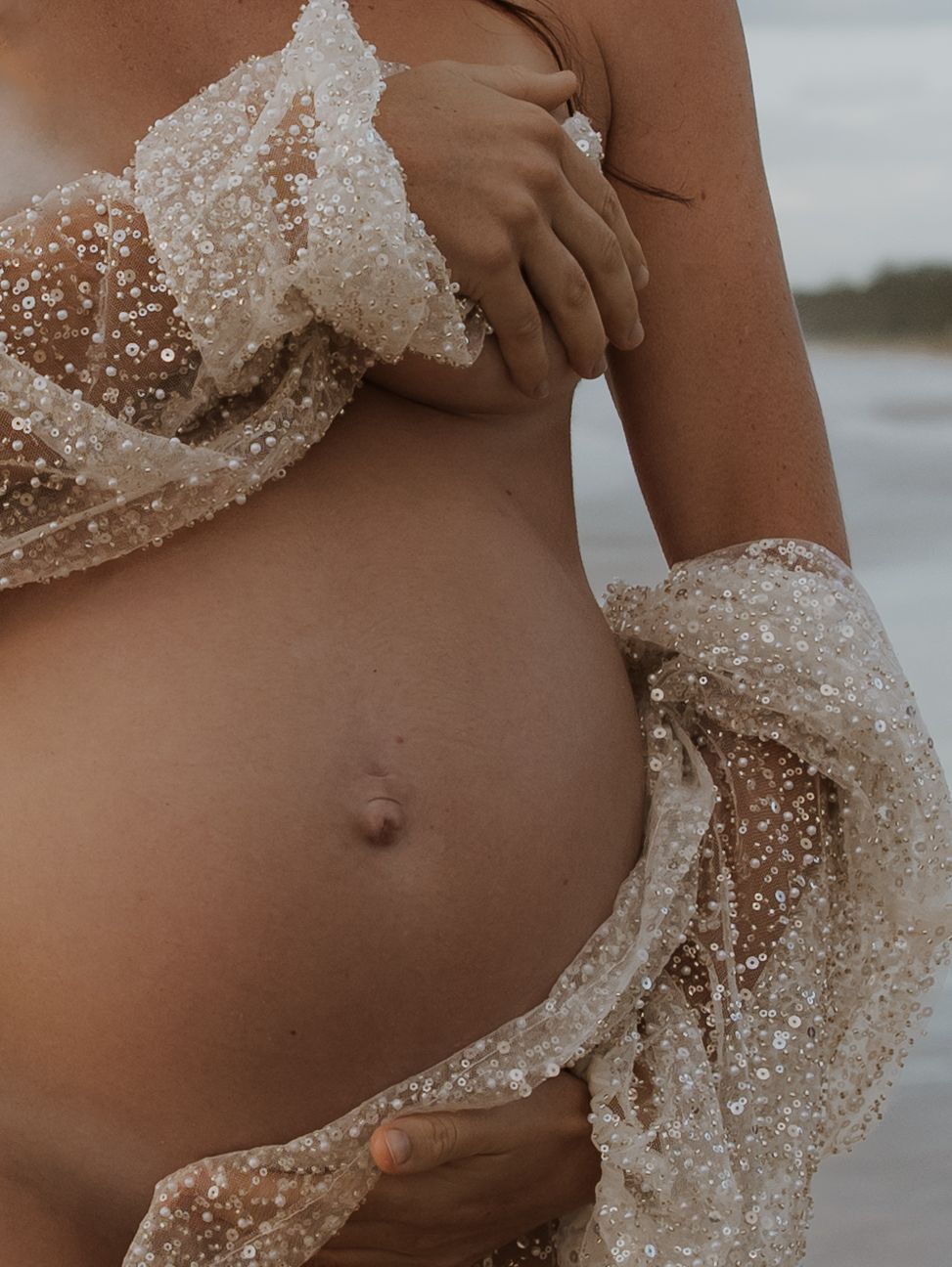 Close up of pregnant belly.