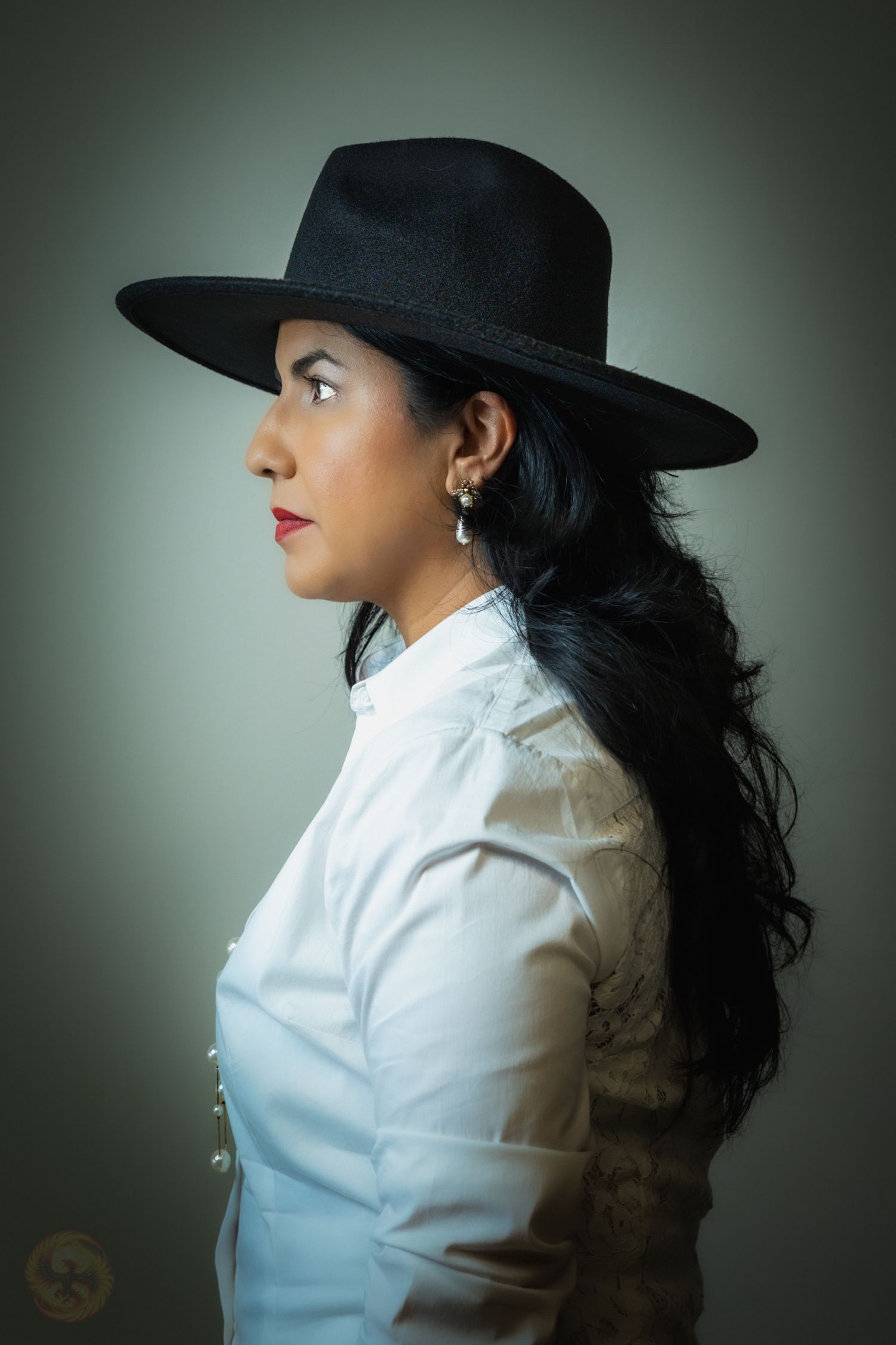 Profile portrait series in a white blouse and black hat against a gradient background.