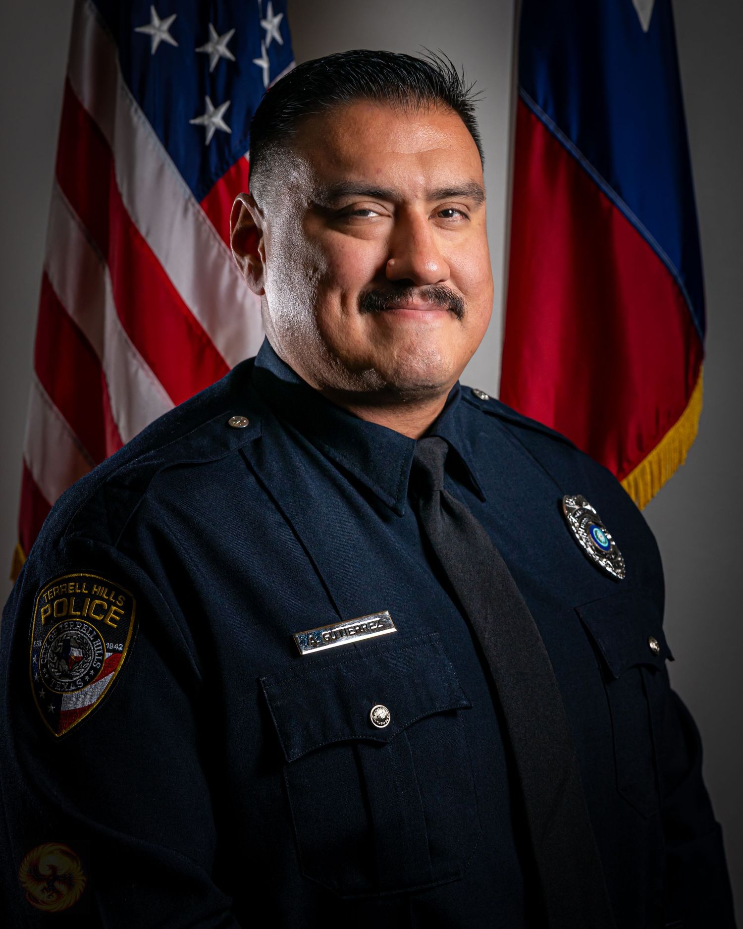 Police officer portraits in uniform against American and state flags in dramatic lighting.