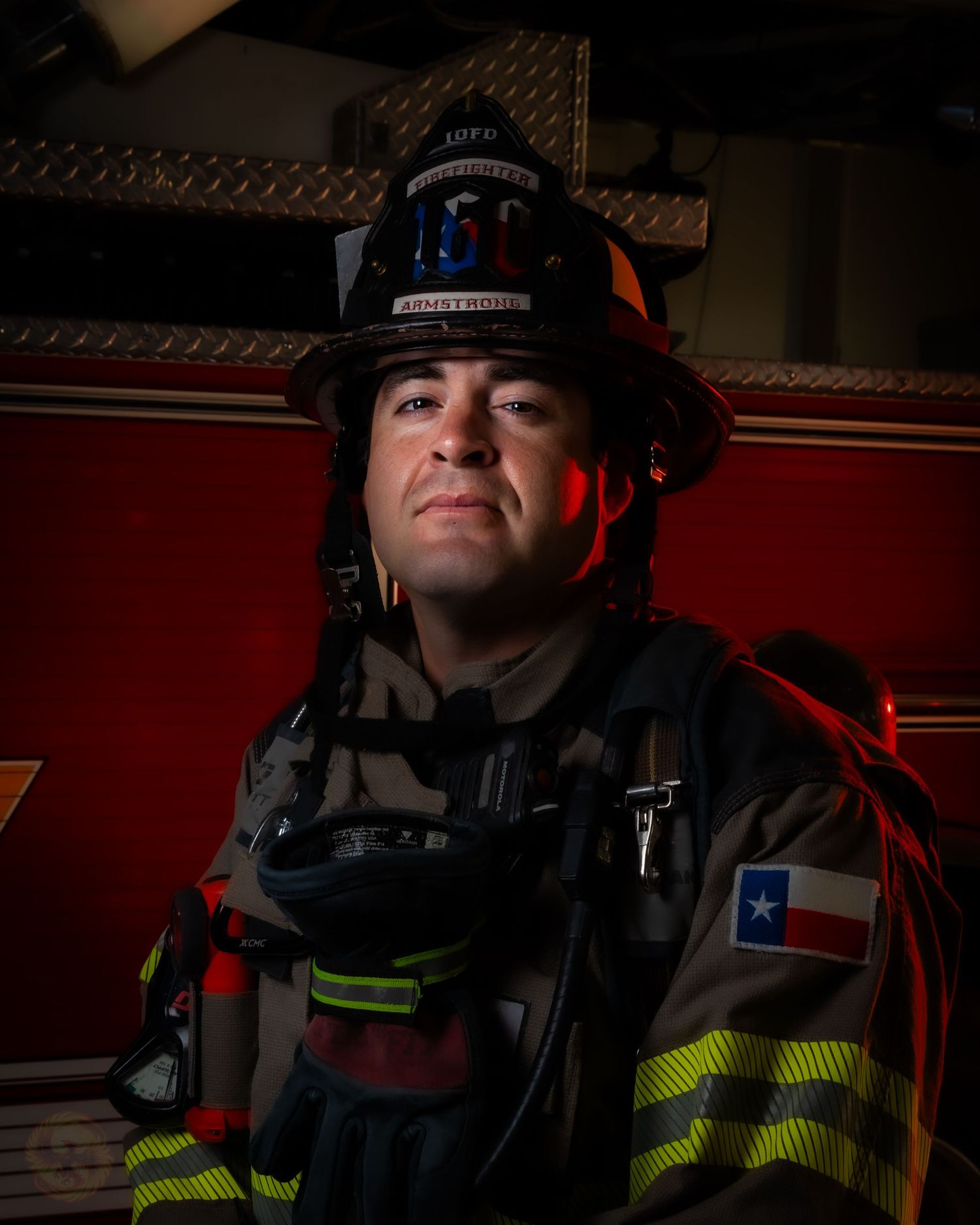 Dramatic portraits of firefighters in protective gear and helmets against dark background.