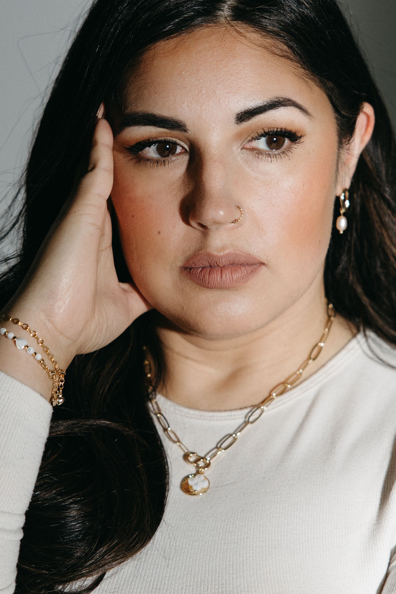 Gold chain necklace styling shown in series of fashion portraits.