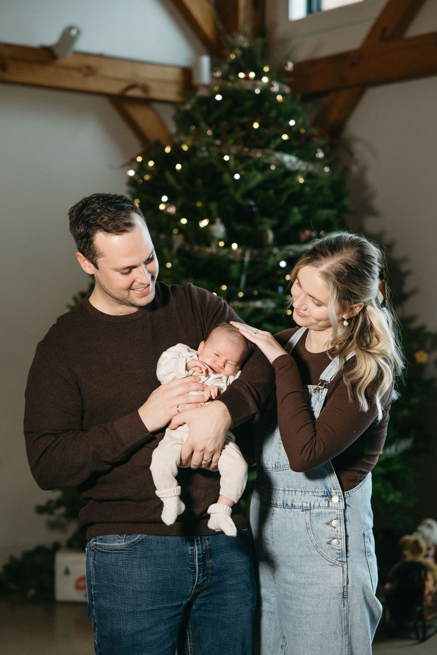 Natural light photography capturing tender family moments during the holiday season.