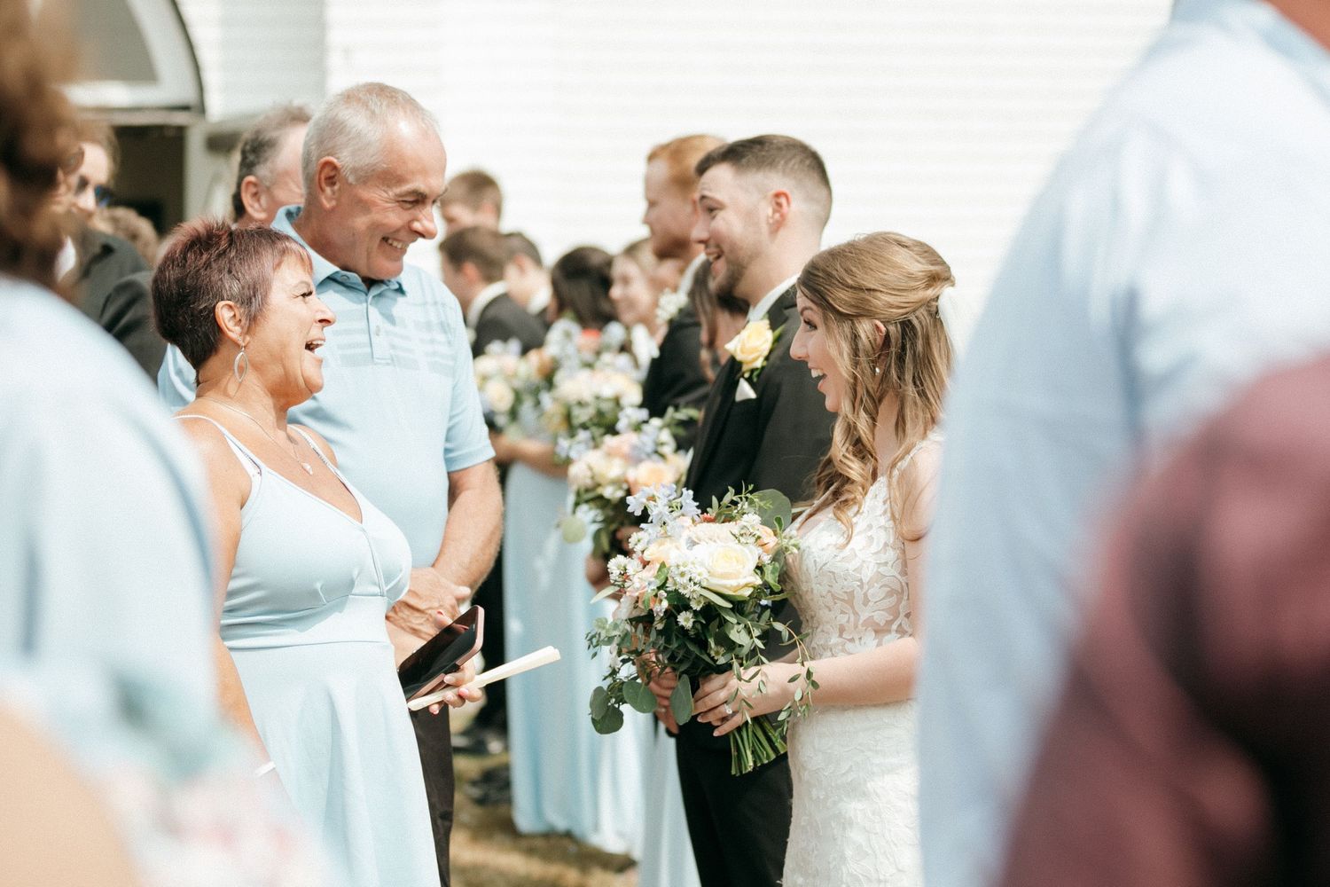 Wedding guests mingling and socializing during an elegant celebration.