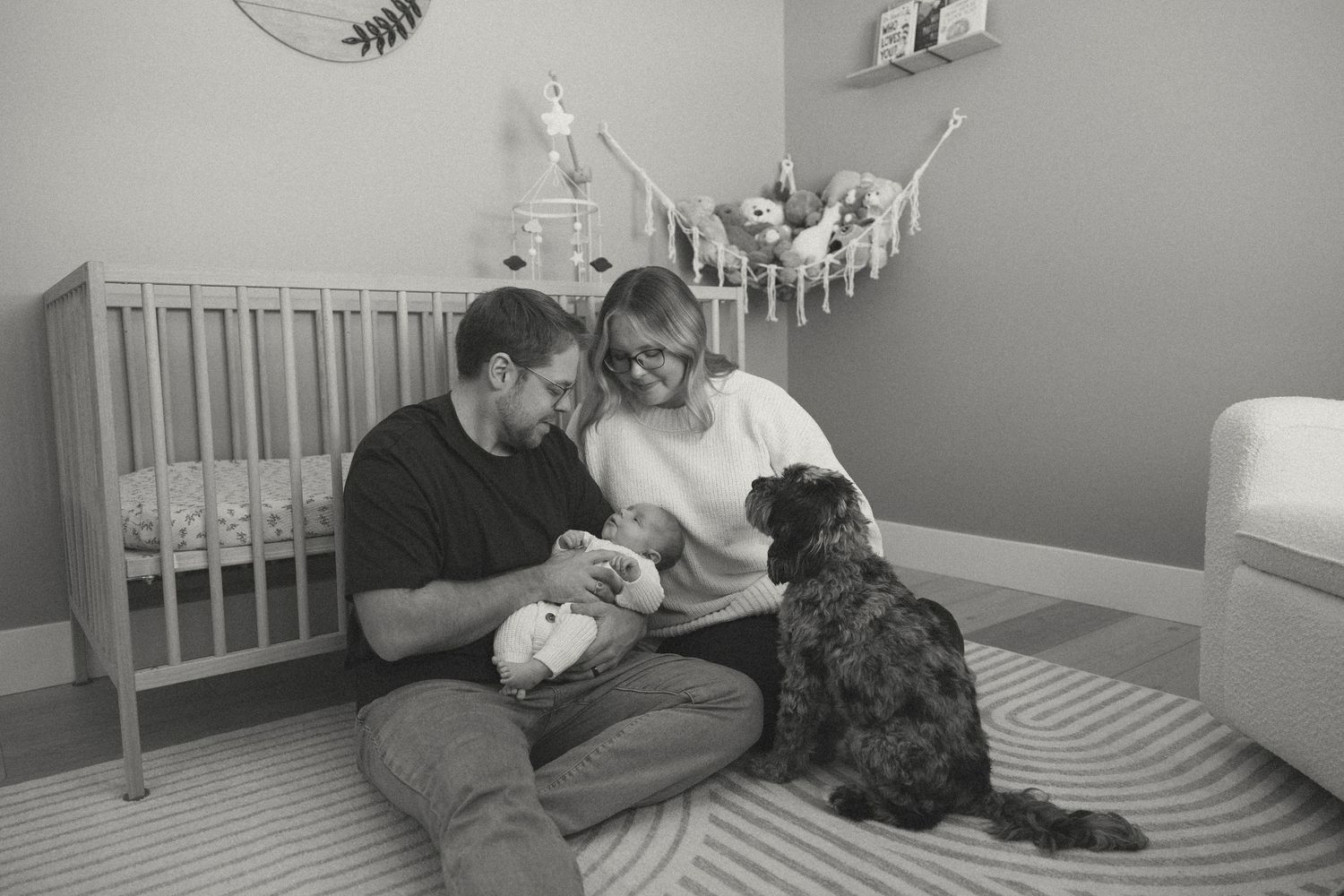 Black and white photo series showing a dog and person relaxing on a bed in a bedroom.