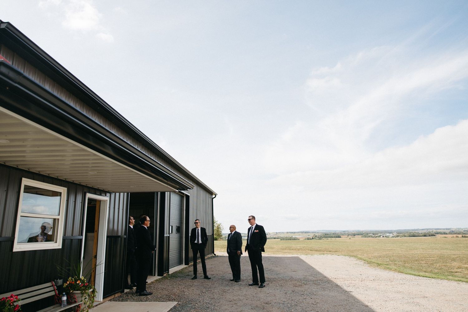 People standing outside a modern building with panoramic views.