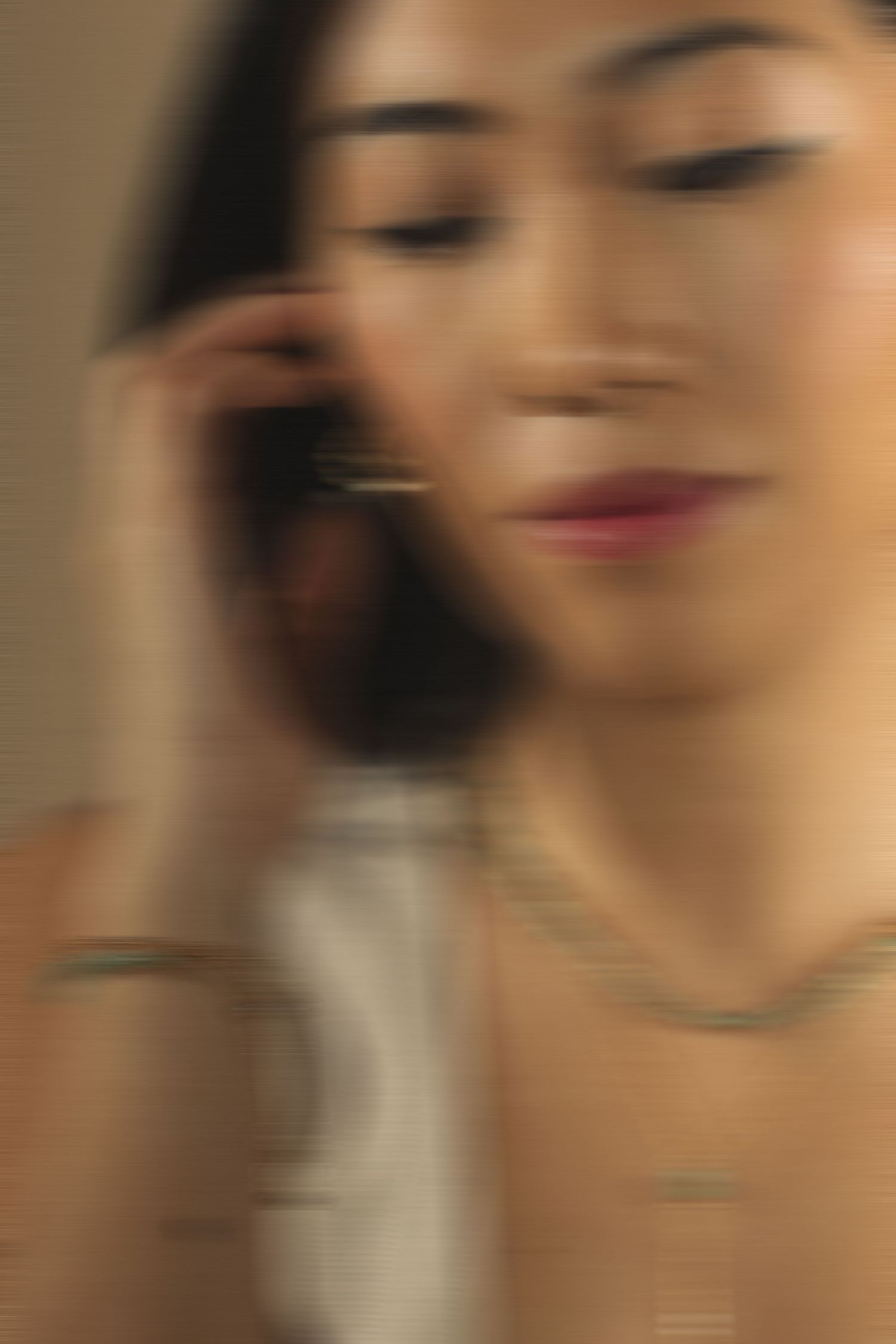 A series of blurred close-up portraits showing soft focus facial features in warm tones.