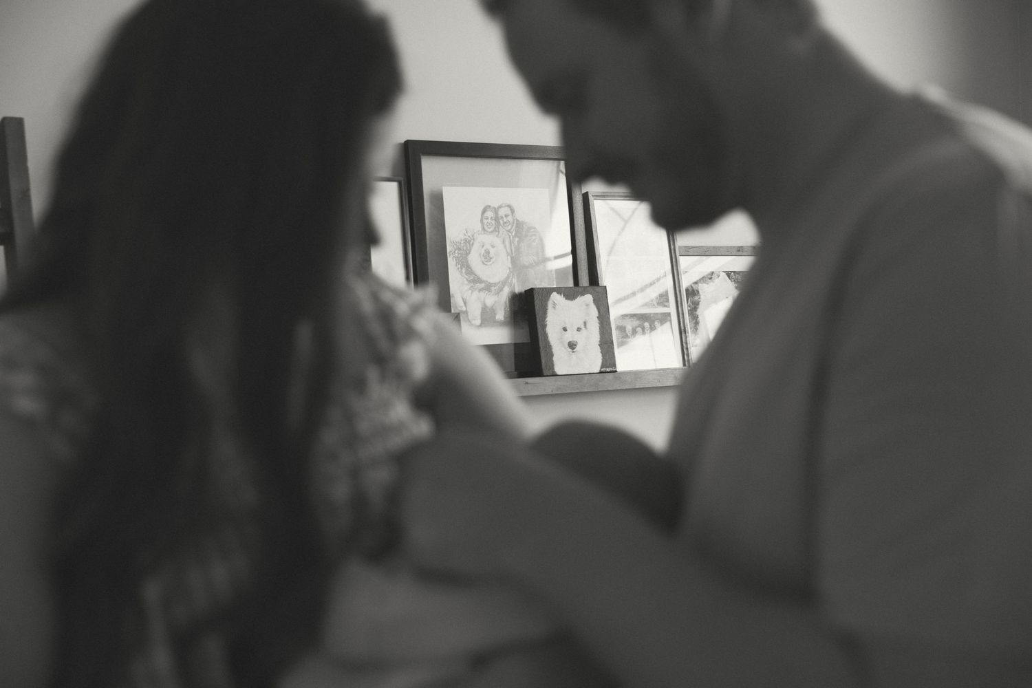 Intimate indoor portrait session with soft natural window lighting.