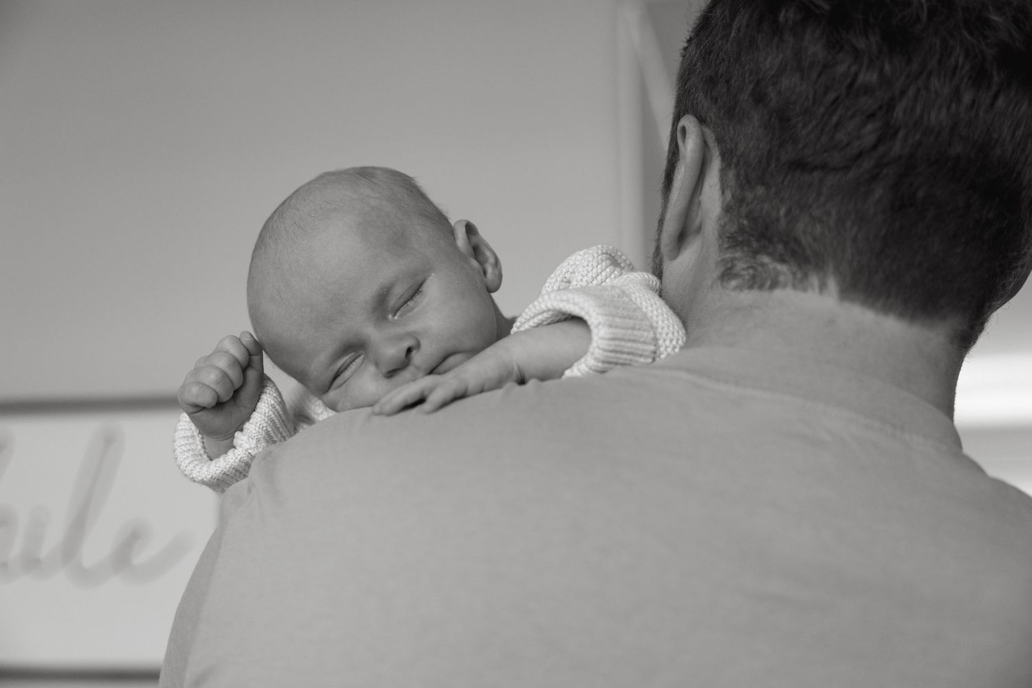 Close-up black and white shots capture intimate family moments together.