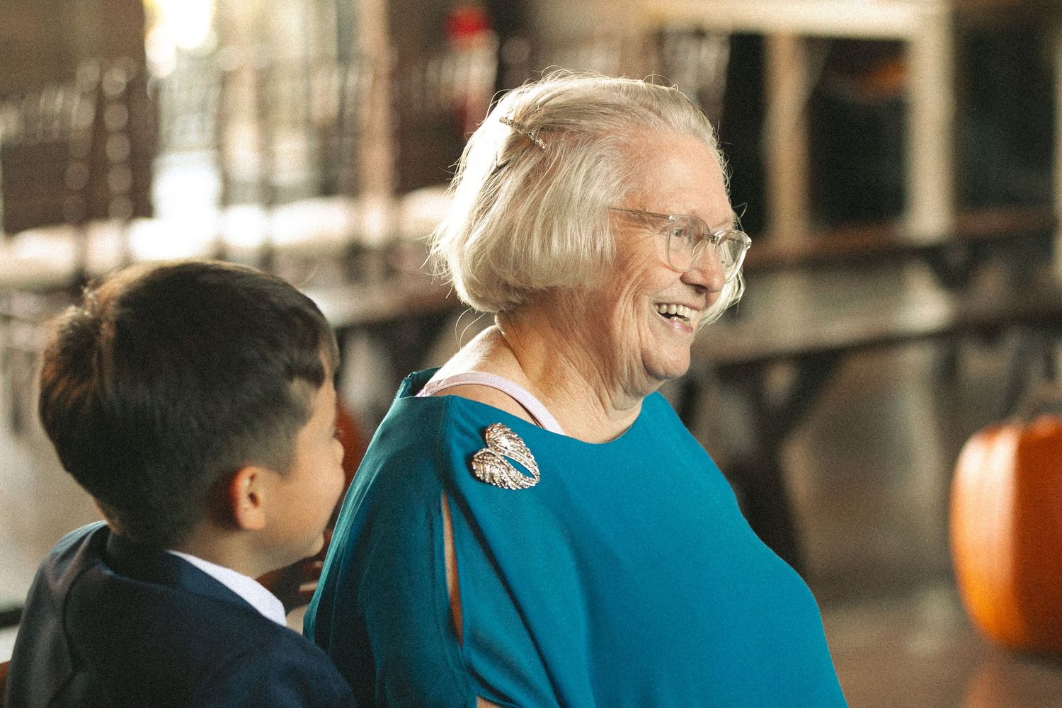 A heartwarming intergenerational moment shared between two people in a casual indoor setting.