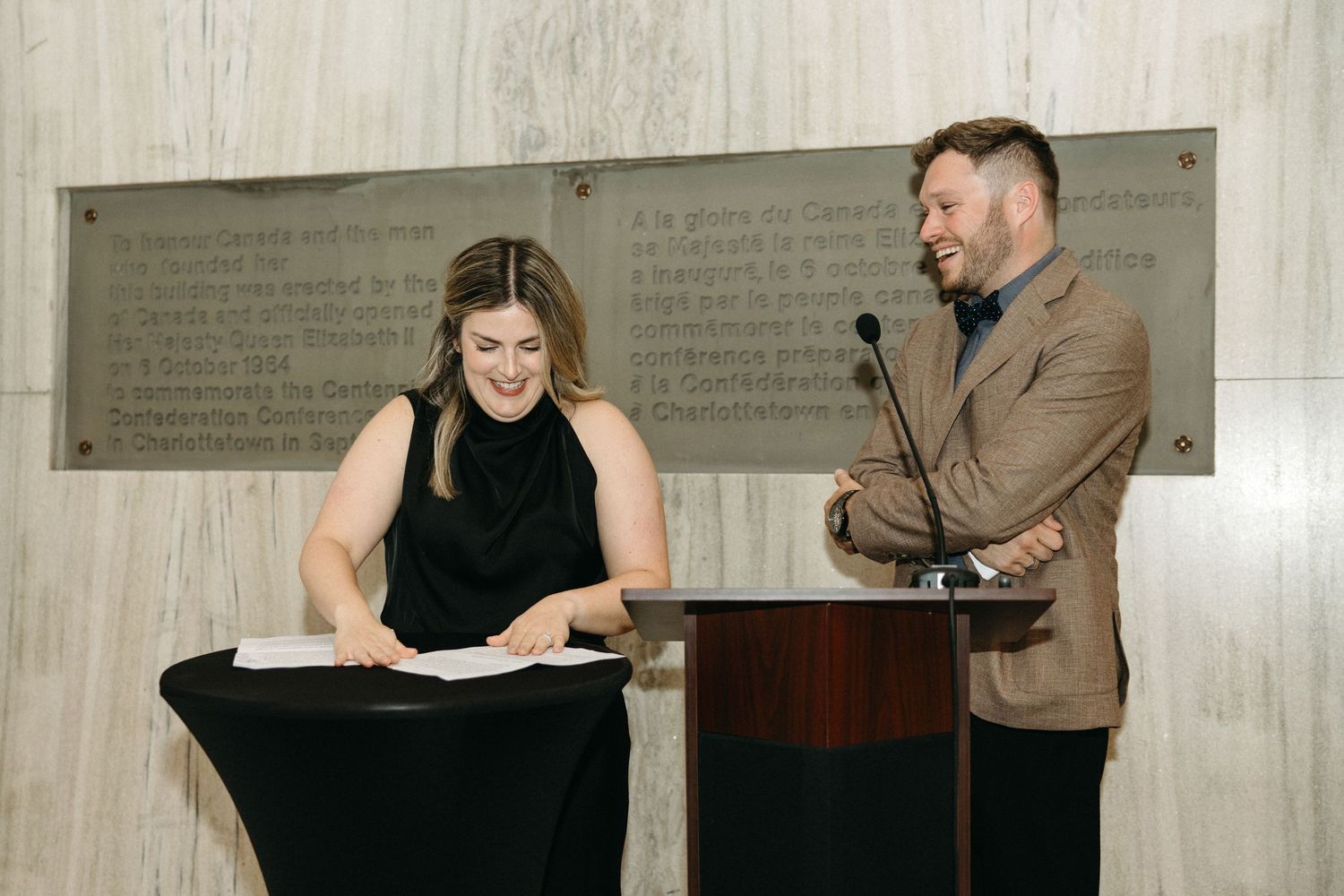 Two speakers at a podium during a formal event.