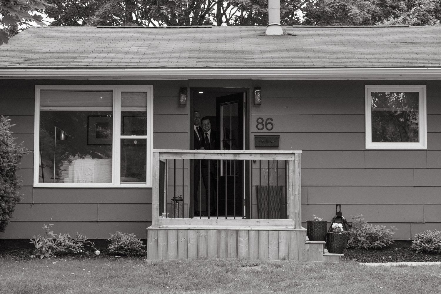 Exterior view of a modern gray ranch-style house with white trim.