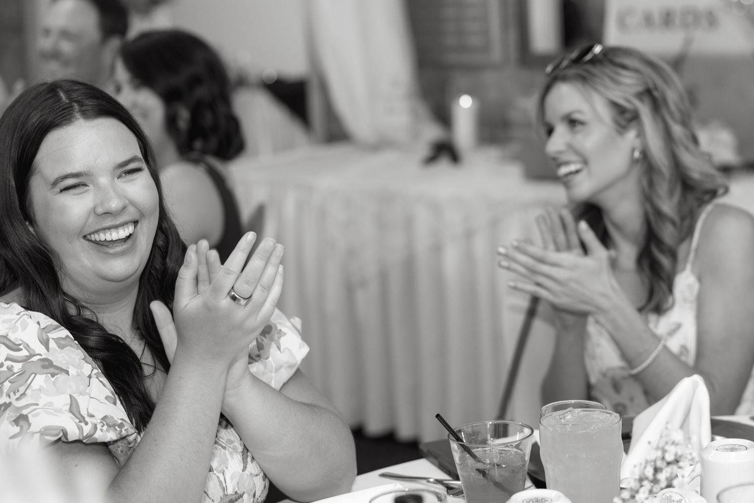Candid moments of joy and laughter captured during wedding celebration.