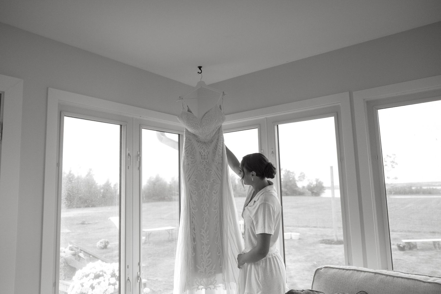 Bright sunlight streams through large windows in a modern room interior.