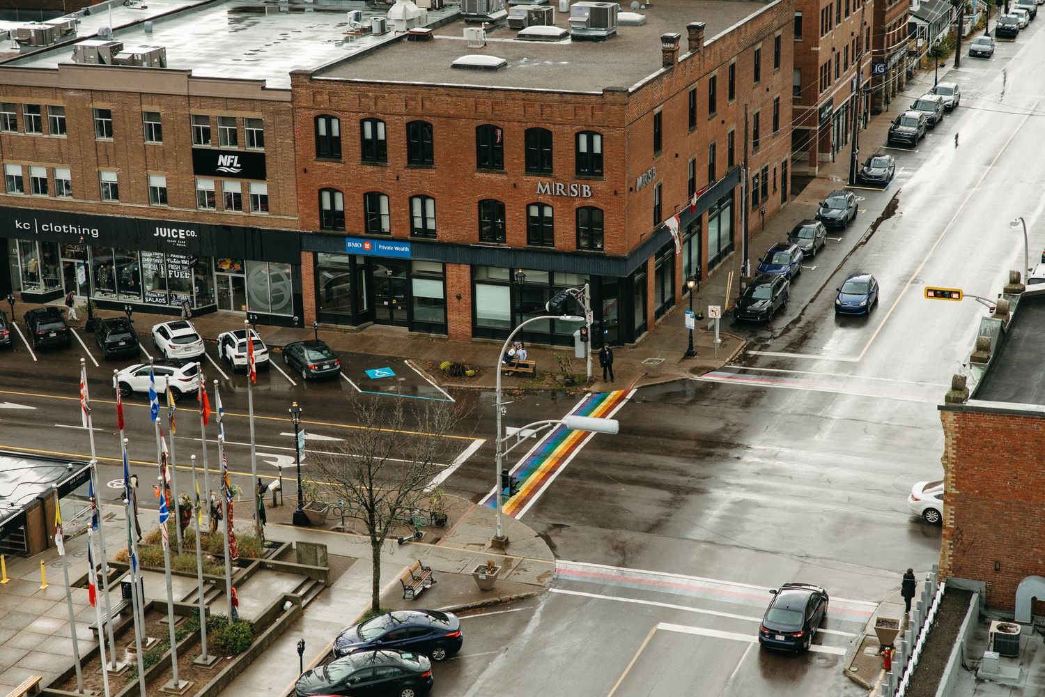 Aerial view of brick buildings and city streets in an urban neighborhood.