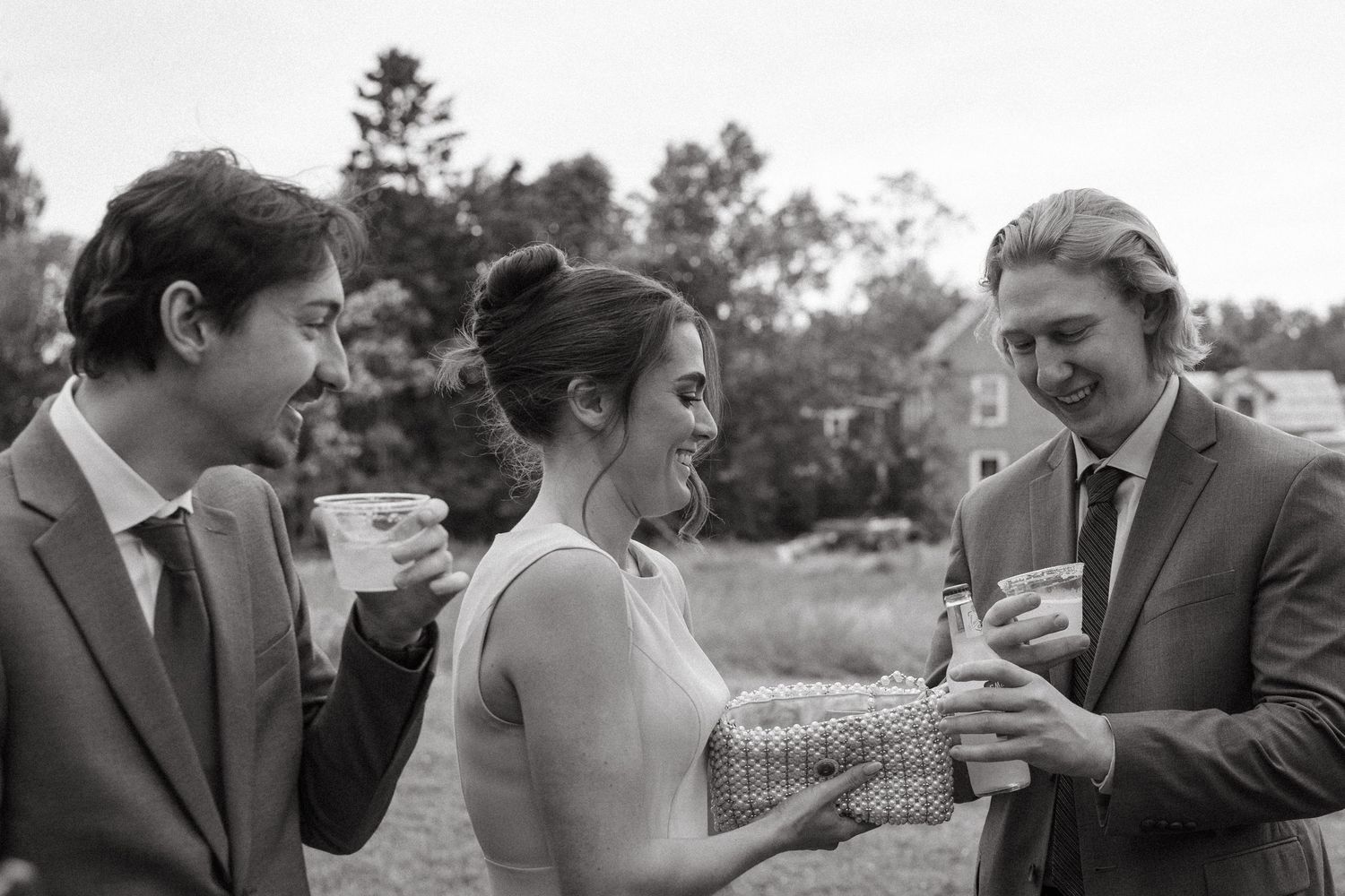Wedding guests mingling during an outdoor cocktail hour.