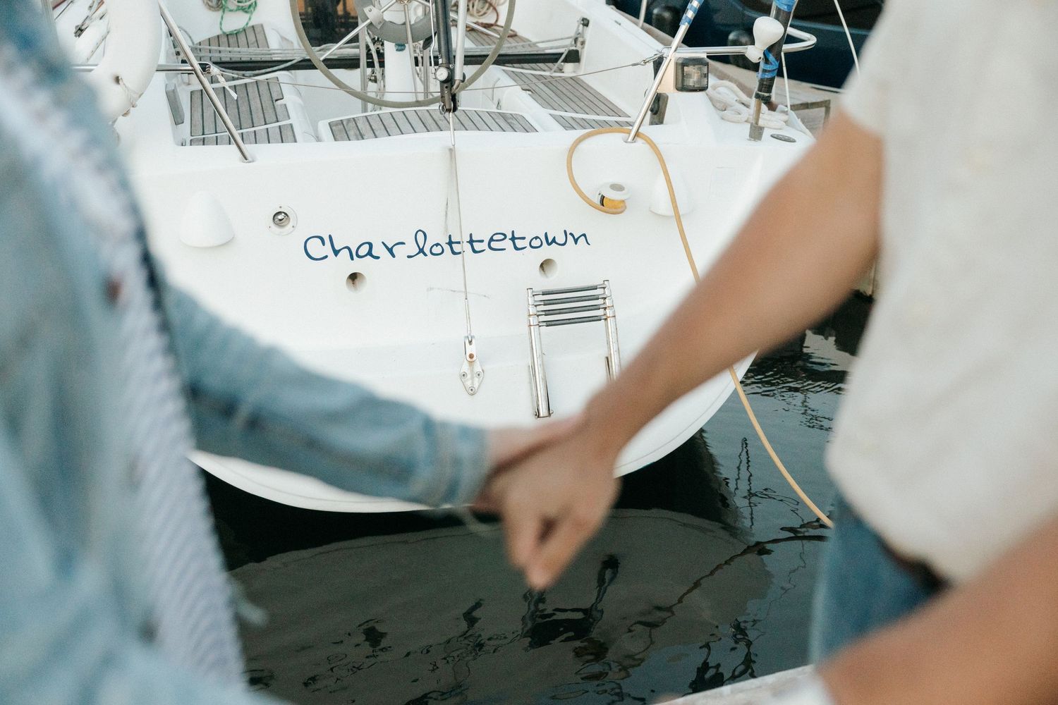 Detail shot of nautical maps and sailing equipment on a boat deck.