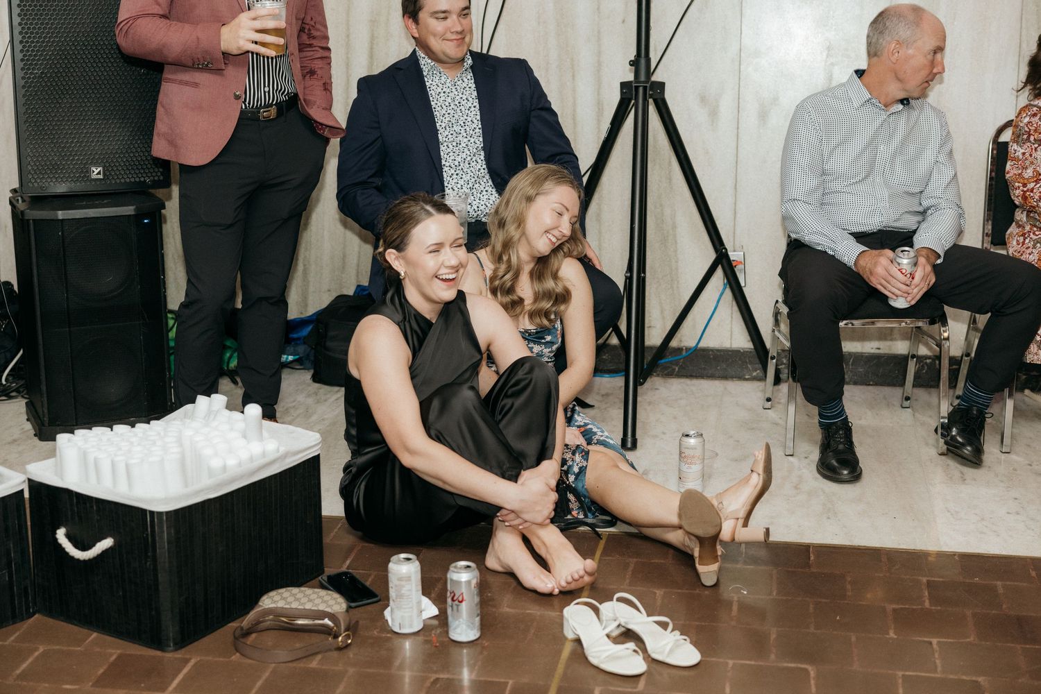 Wedding guests dancing and celebrating together at a lively reception party.