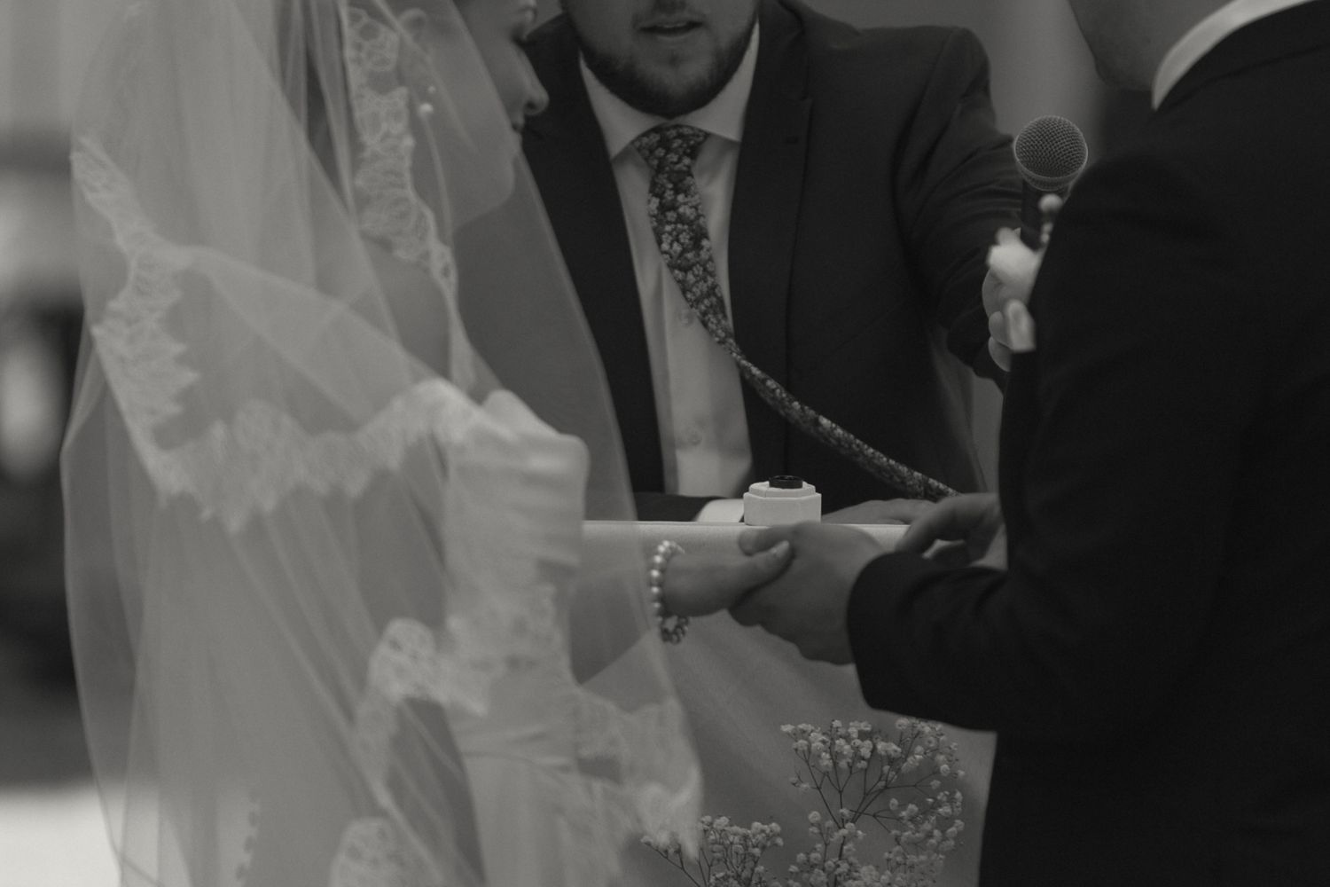 Close-up view of wedding ceremony details with formal attire.