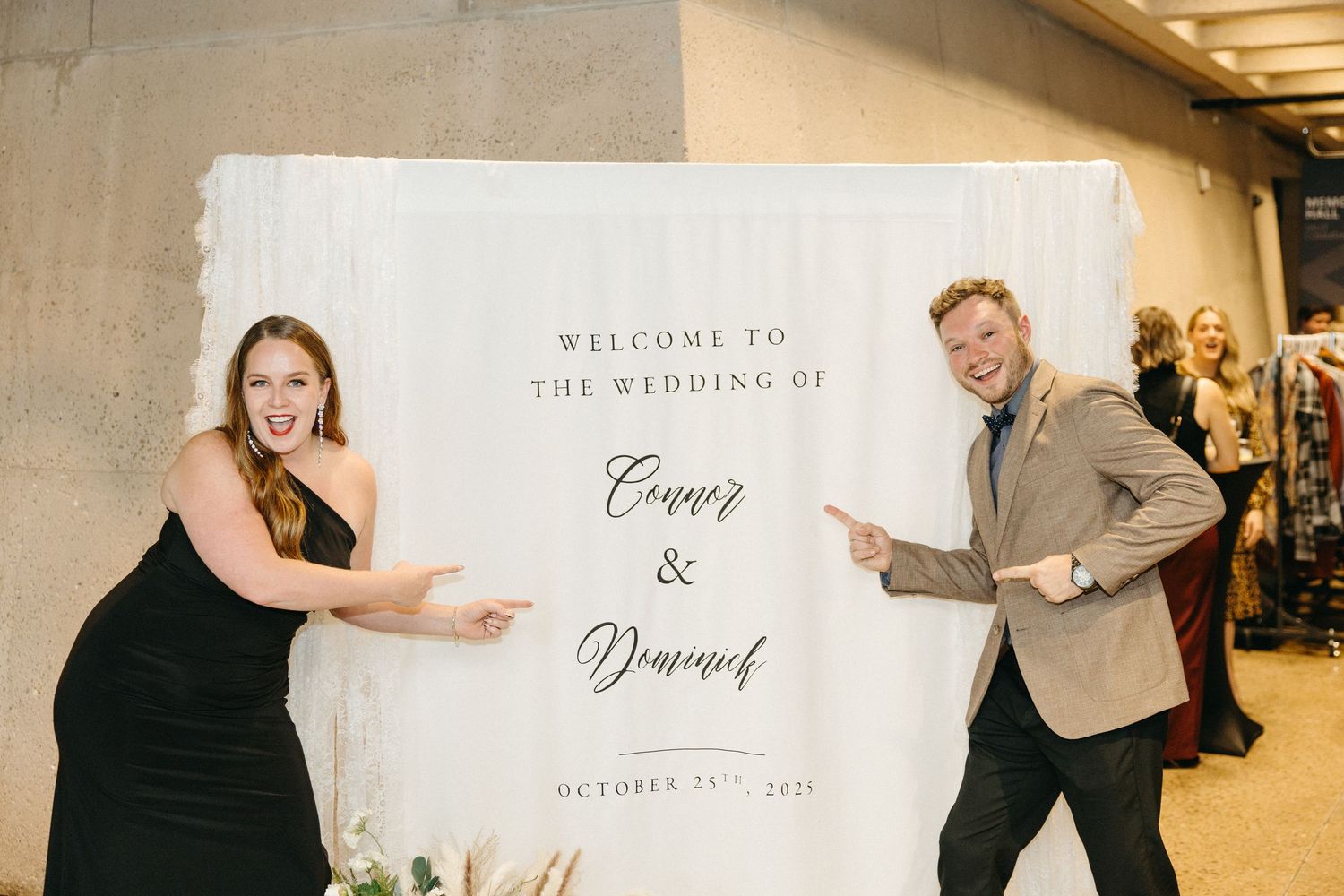 Wedding welcome sign and decorations displayed at venue entrance.