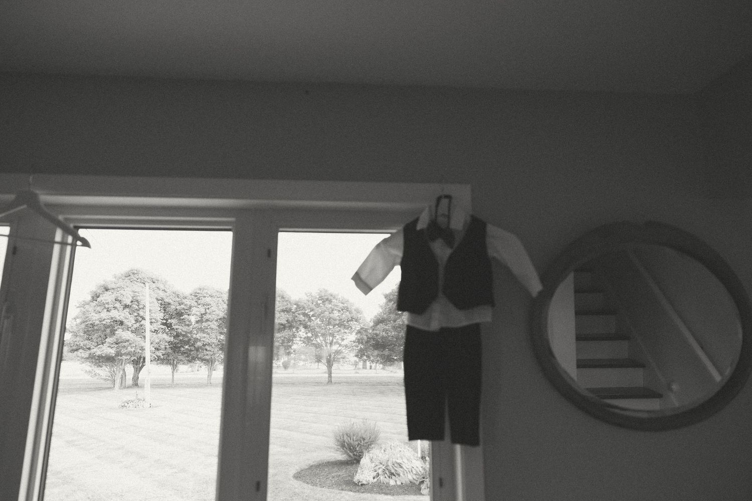 Interior view of room with window showing outdoor scenery.
