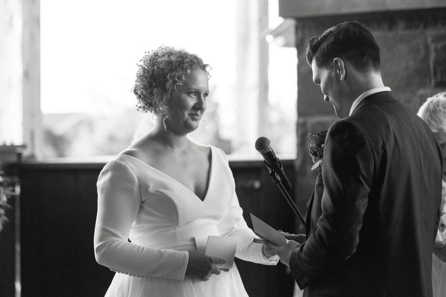 Black and white candid shots of guests during a wedding ceremony.