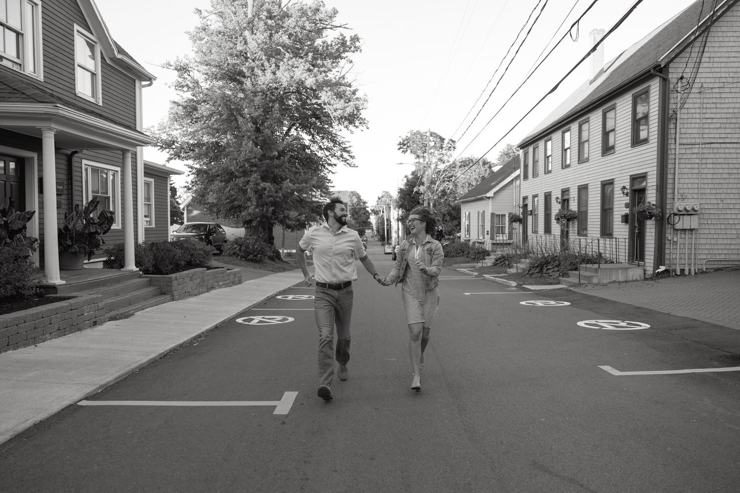 A sequence of black and white street scenes showing a quiet residential neighborhood.