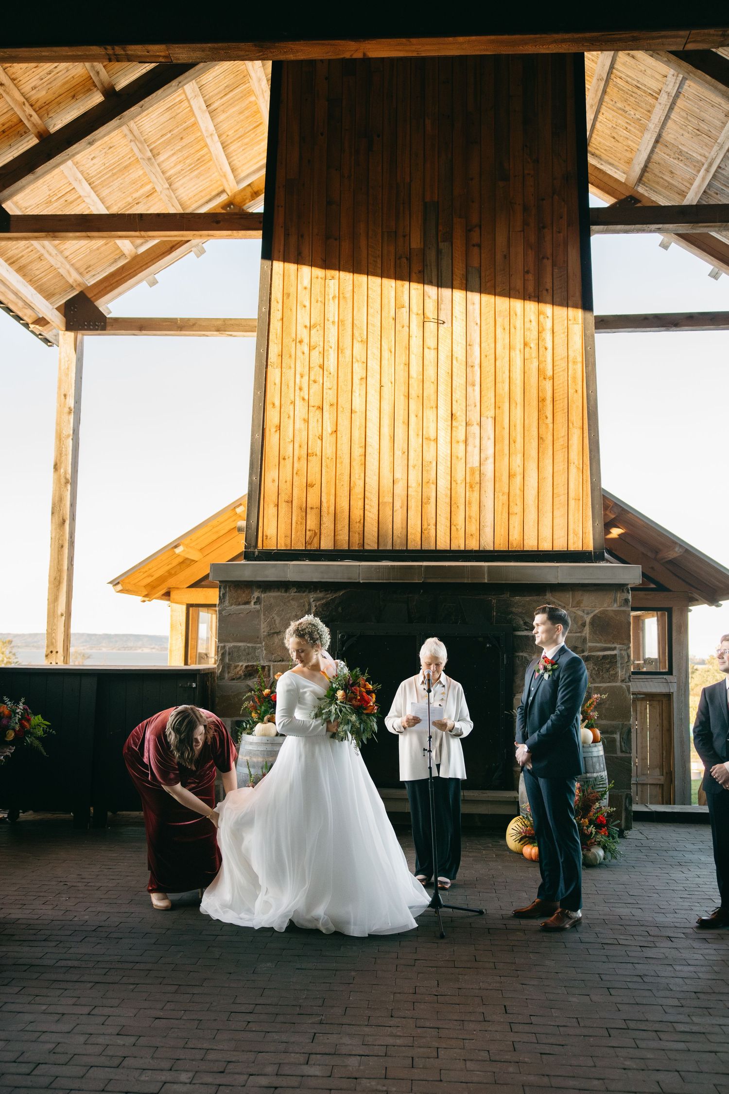 Wedding ceremony progression shown in a series of photos inside a wooden barn venue.