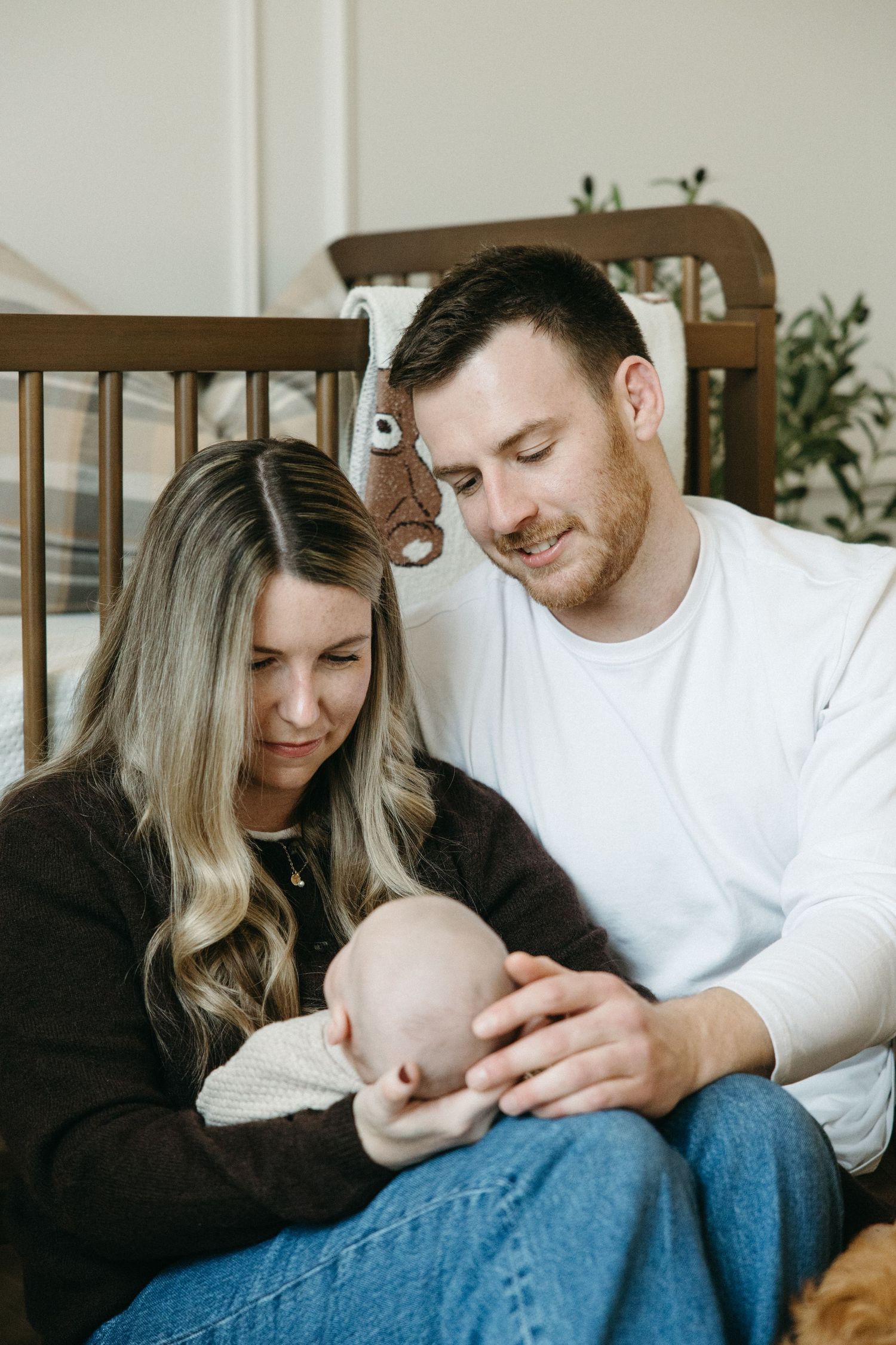 Intimate family moment shared on couch with baby.
