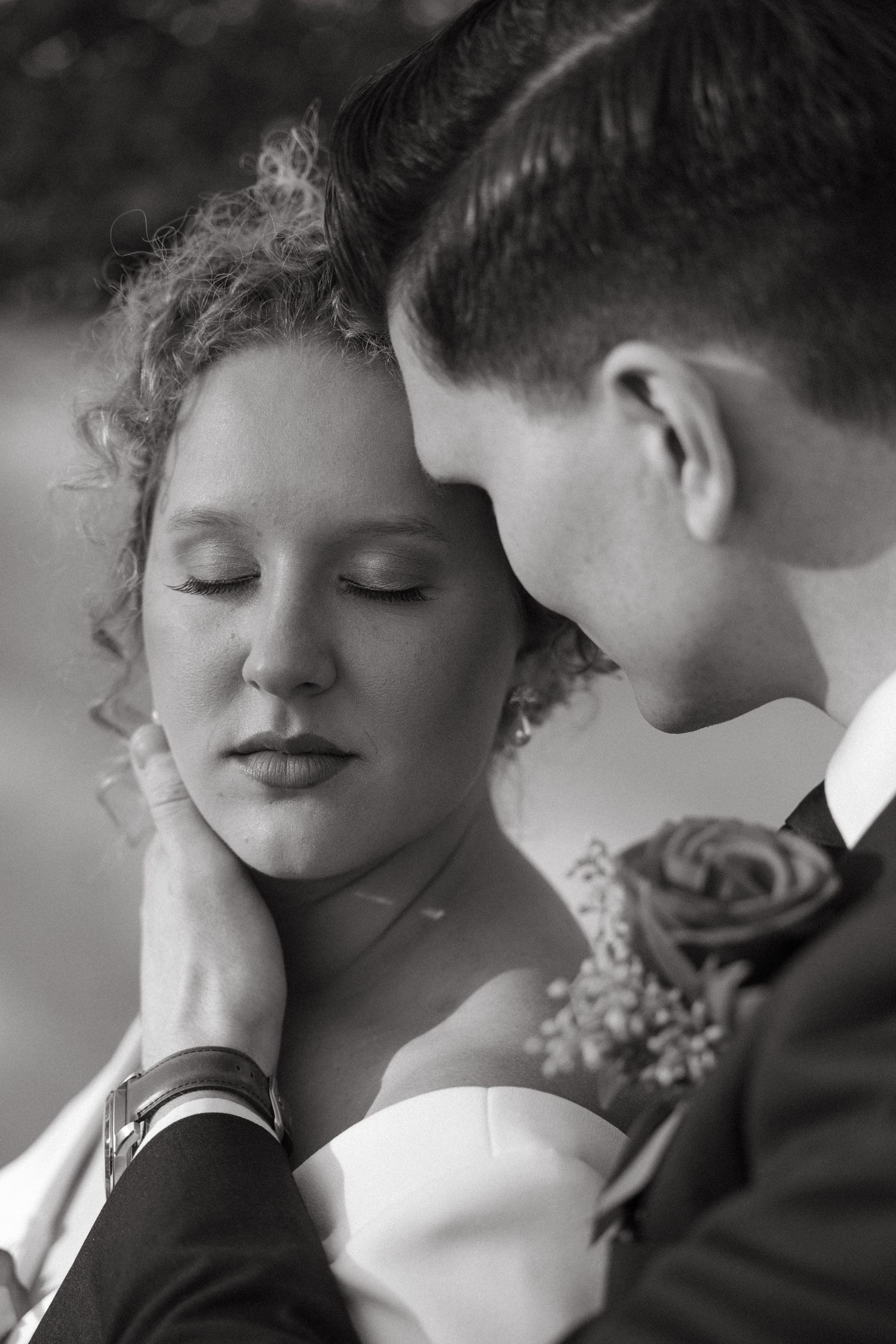 Intimate black and white wedding portraits showing tender romantic moments.