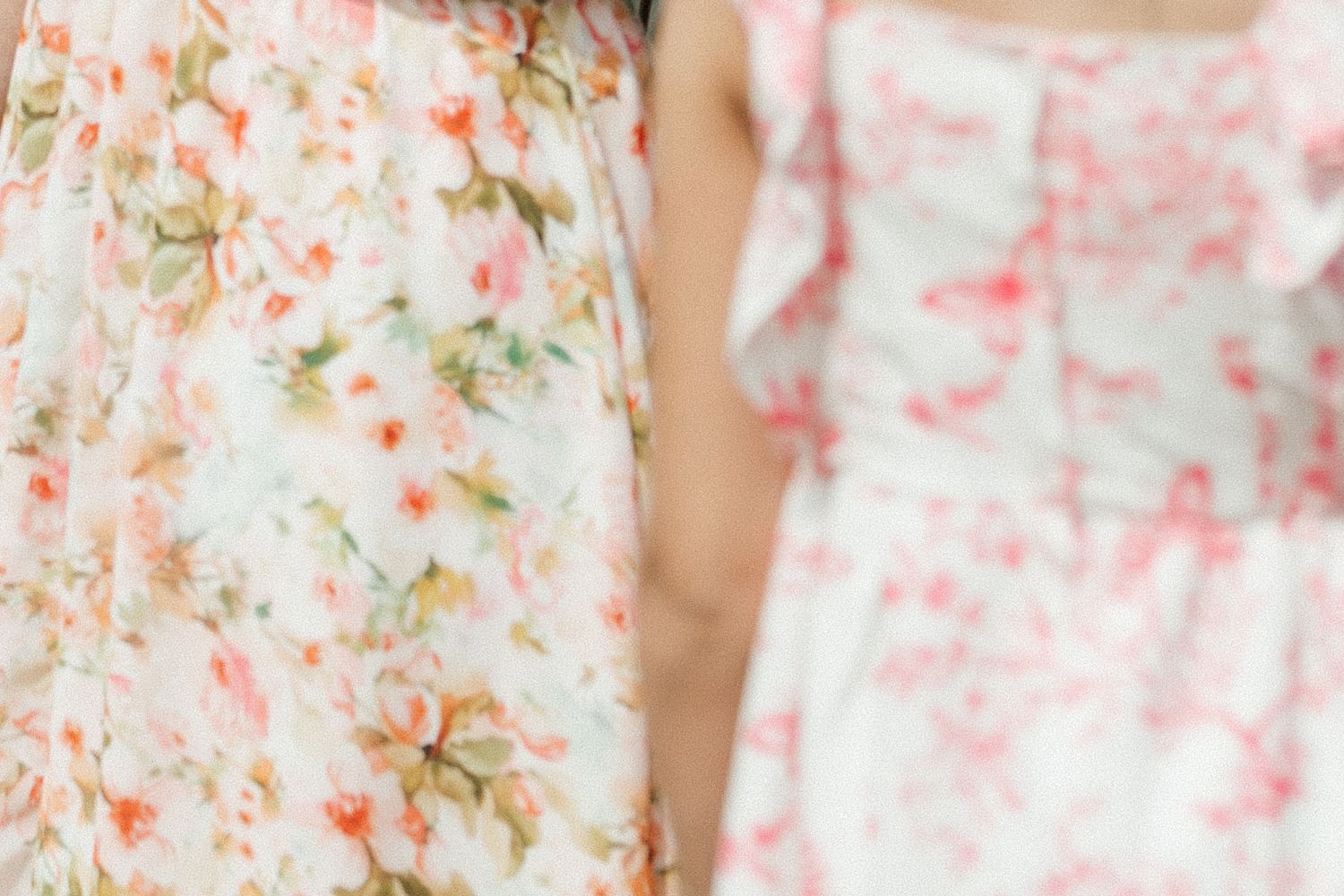 Delicate floral pattern in soft pink and peach tones creating a romantic background.