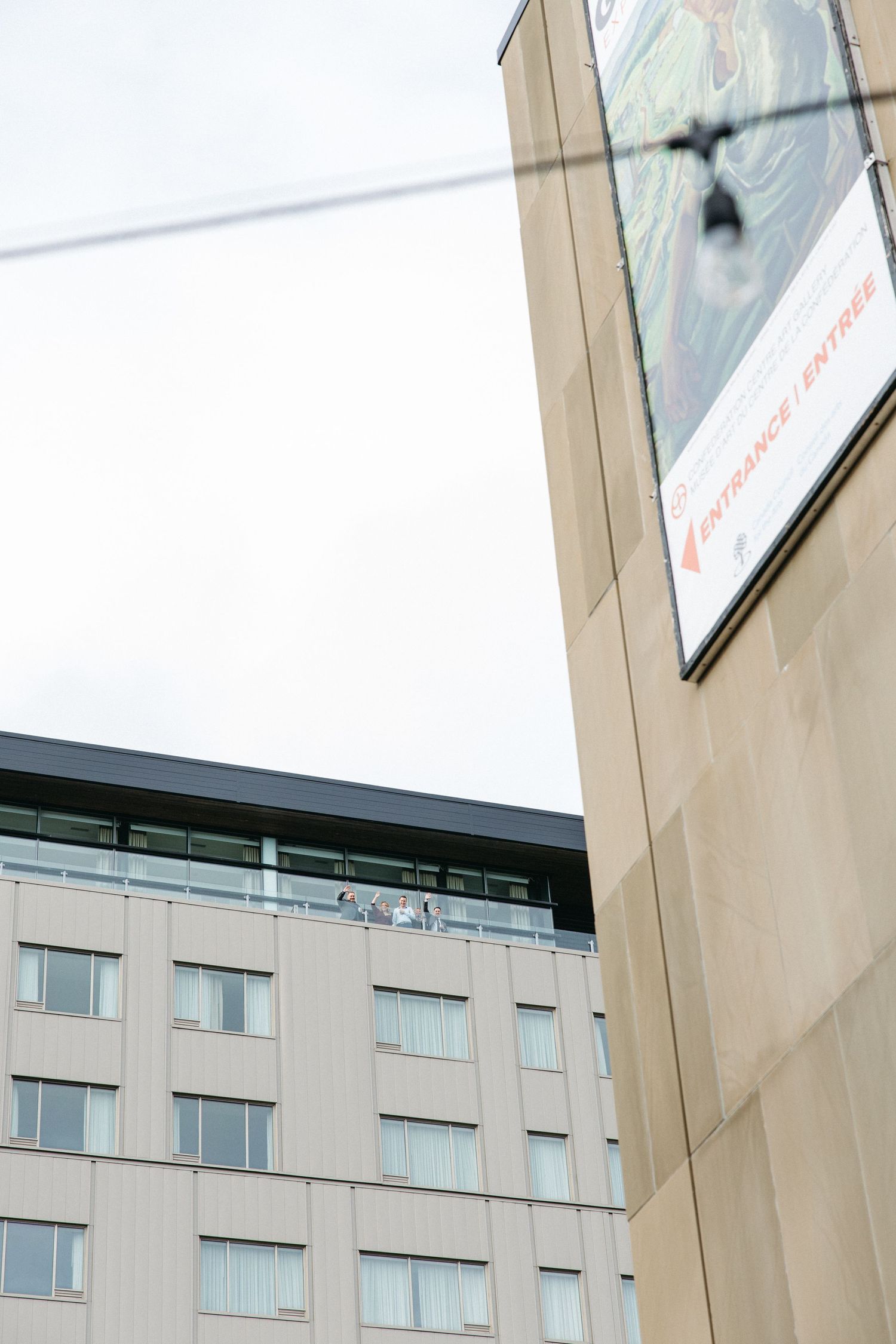 Modern office building exterior with glass windows and geometric architecture.