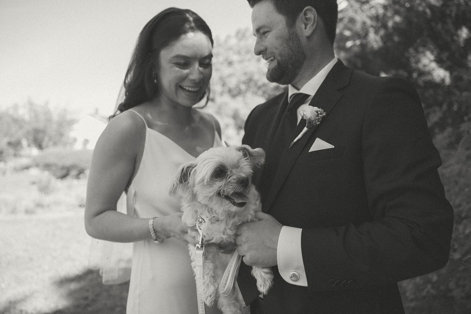A tender wedding moment captured in black and white photography.