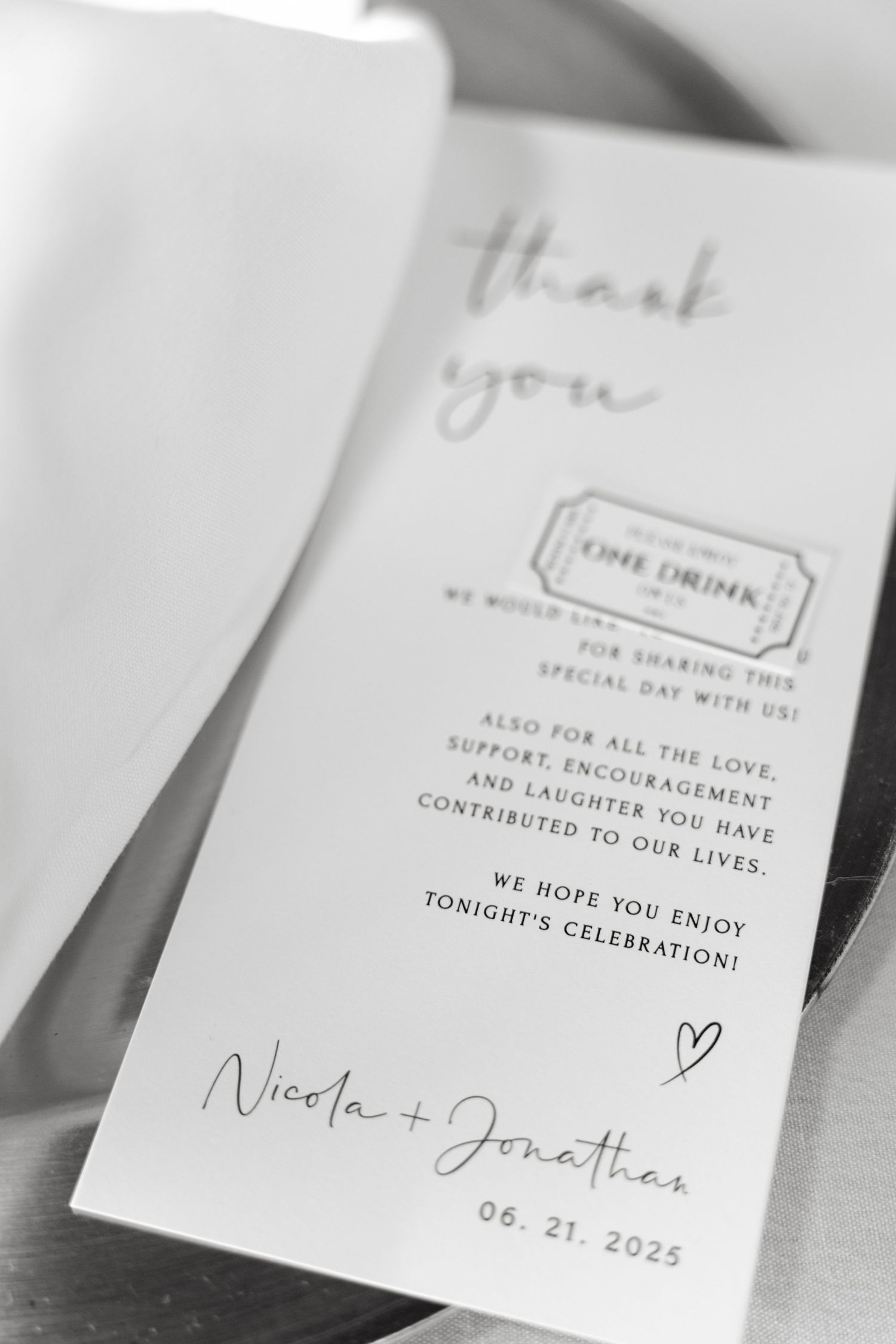 Close-up of elegant wedding thank you cards with handwritten text and minimalist design.