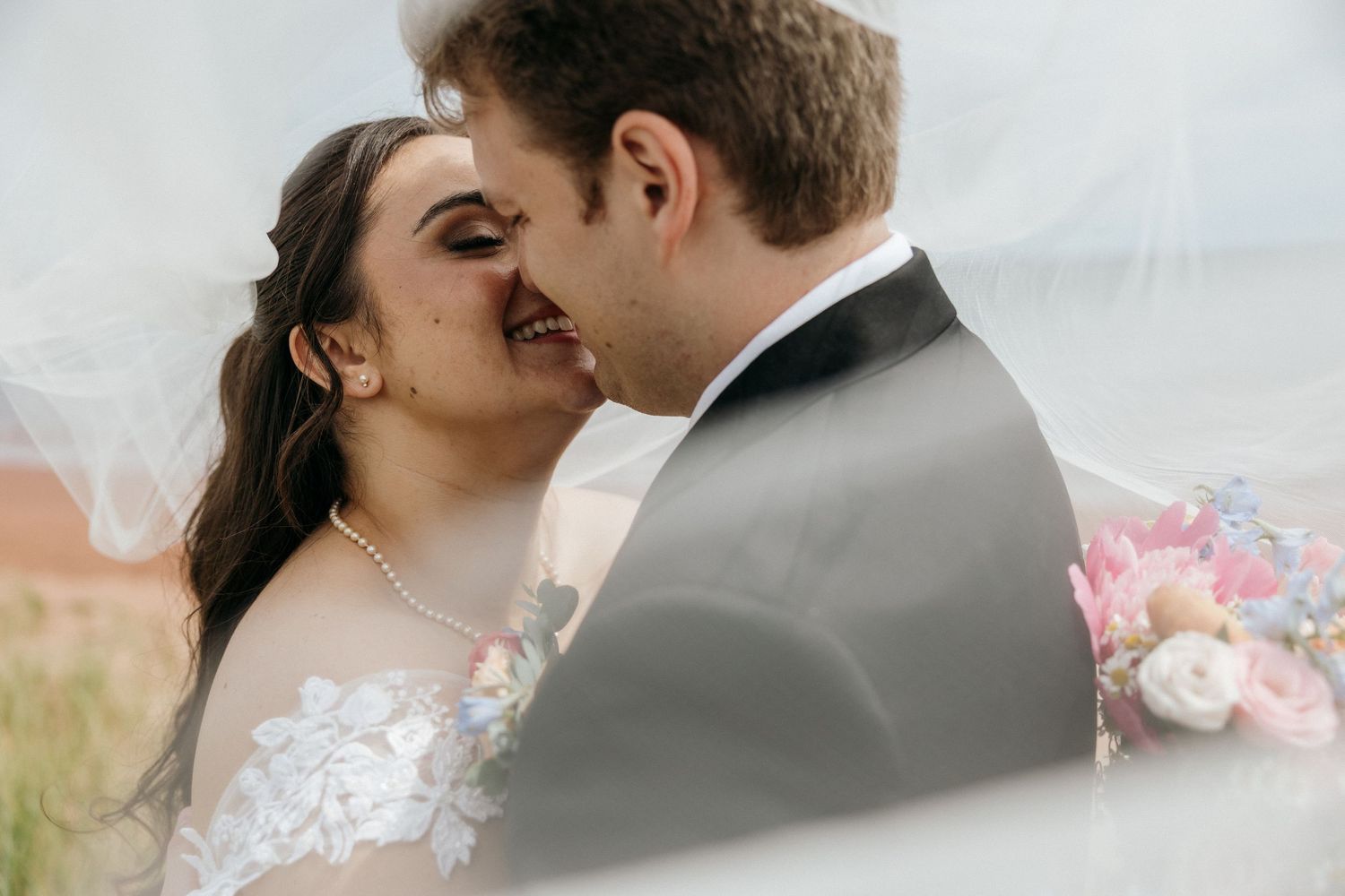 Close-up romantic wedding portraits showing tender moments between the couple.