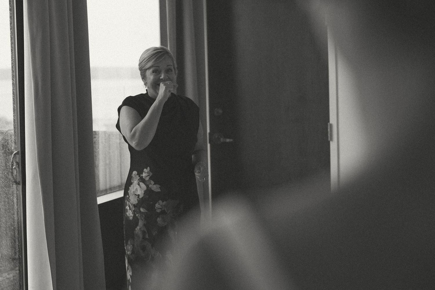 A black and white portrait capturing quiet moments before the wedding ceremony.