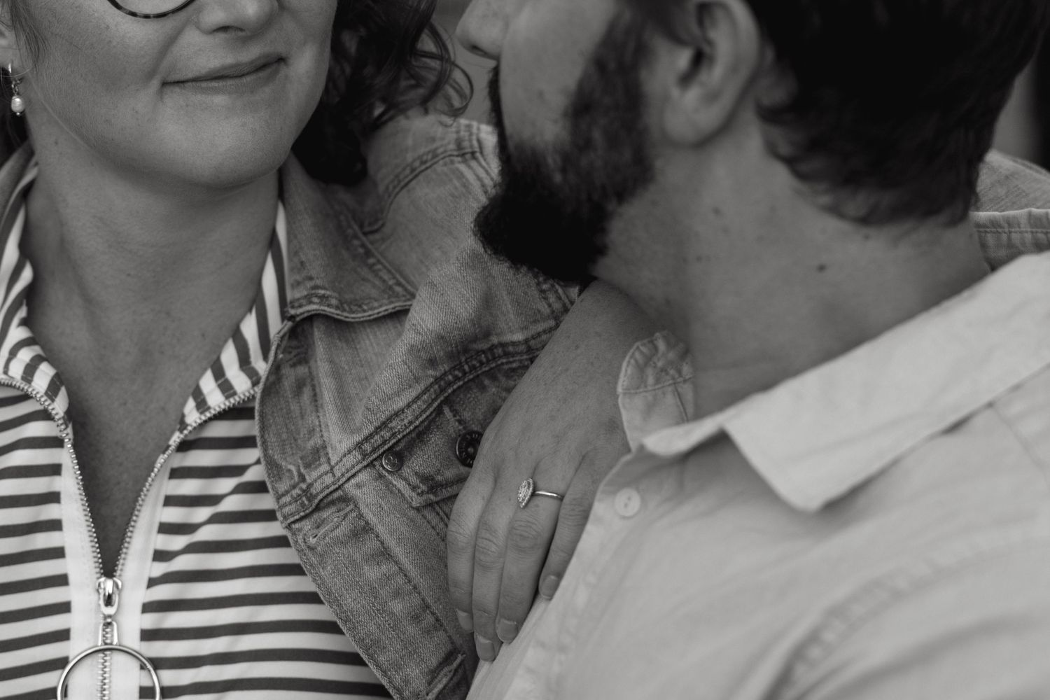 Close-up profile shot of two people in intimate conversation.