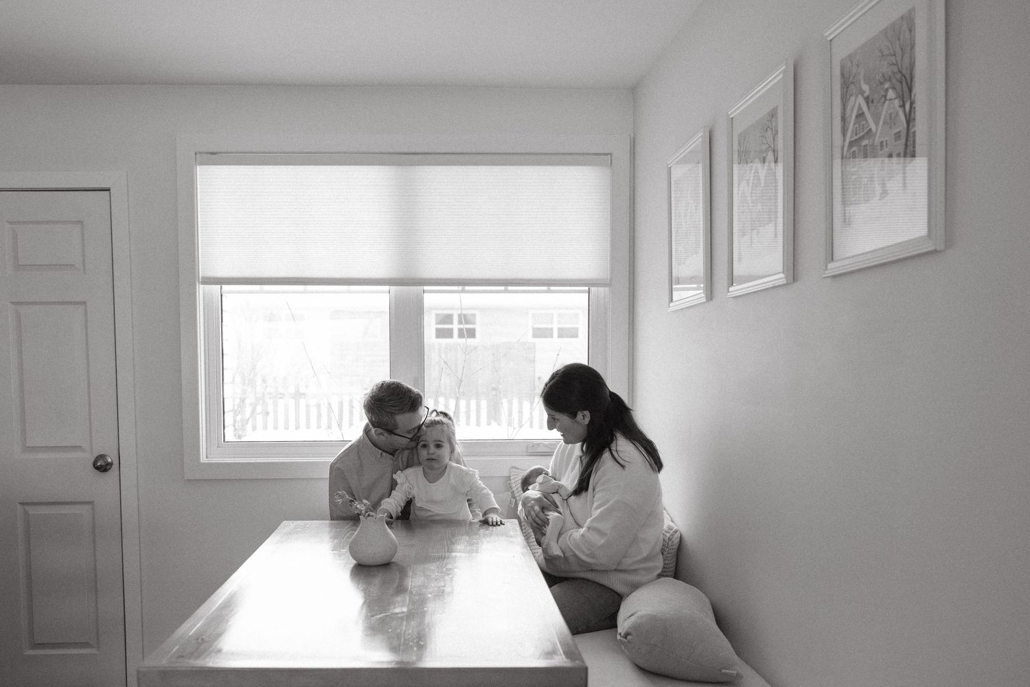 Black and white photo series showing people in a home setting engaged in various activities and interactions.
